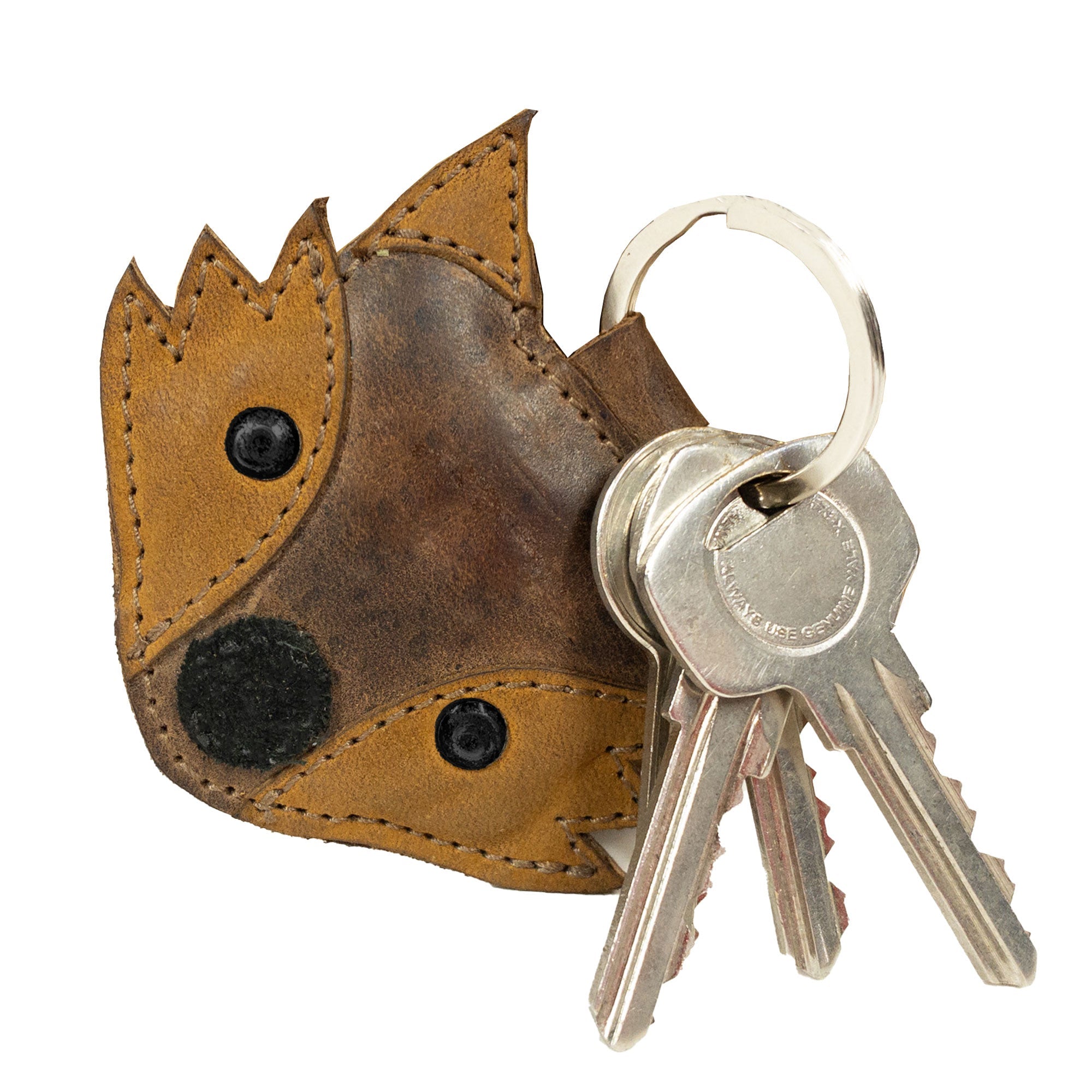 Close-up of a Fox Keychain by Hide & Drink holding keys, highlighting its unique fox face design. Made from durable Full Grain Leather, this key holder is an artisan piece of wildlife-themed accessories, embraced by small batch production techniques in La Antigua Guatemala & Oaxaca Mexico.