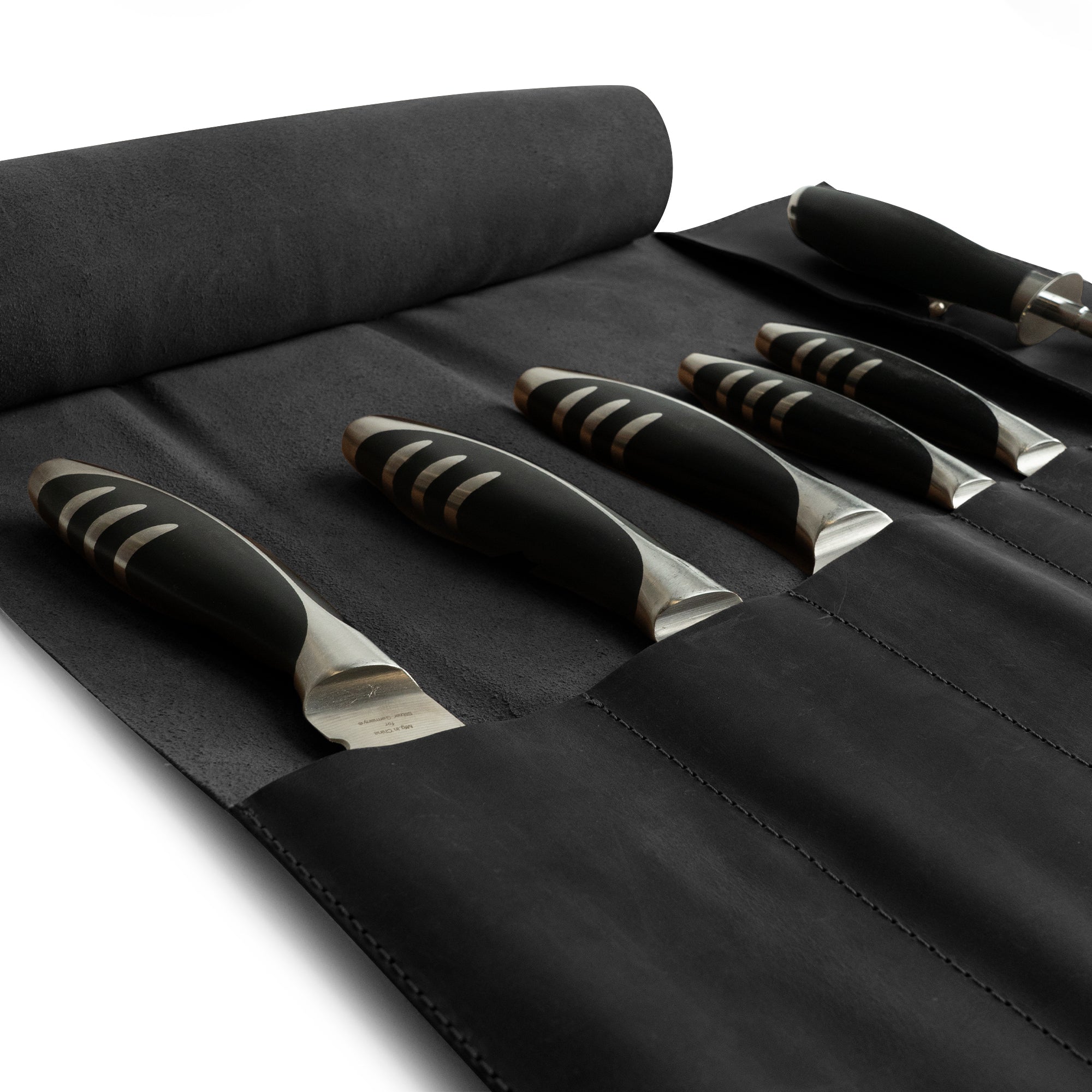 Hide & Drink Knife Roll (5 Pockets) elegantly presented, made from robust Full Grain Leather. This Chef Knife Bag is the perfect portable carrying case for knives, showcasing artisan quality and craftsmanship through small batch production, along with hand cut and hand sewn expertise.