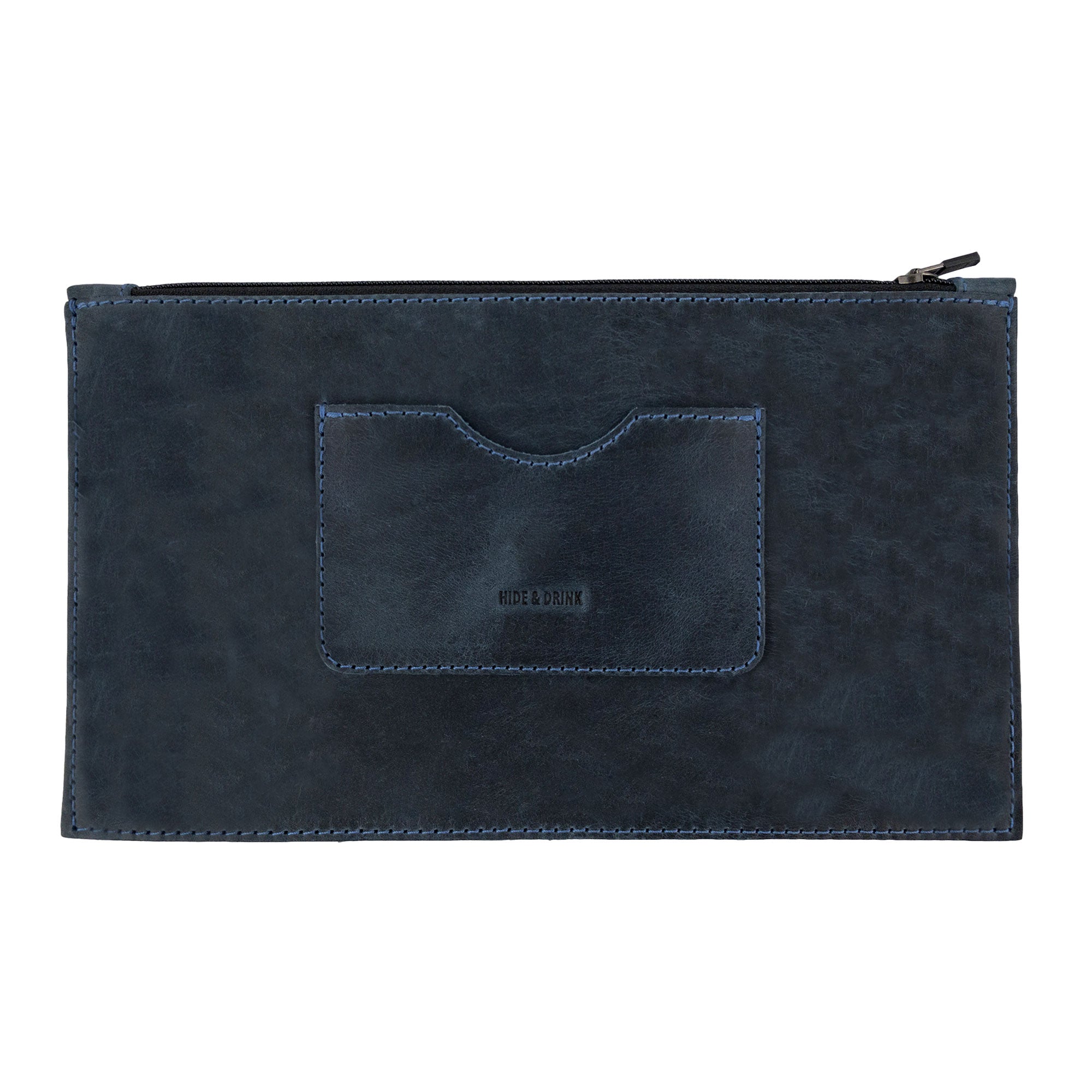 A frontal view of a dark brown rectangular zippered handbag by Hide & Drink emphasizing its elegant design. Perfect for women, this full grain leather female purse includes a card slot, representing artisan craftsmanship through small batch production, handmade in La Antigua Guatemala & Oaxaca Mexico.