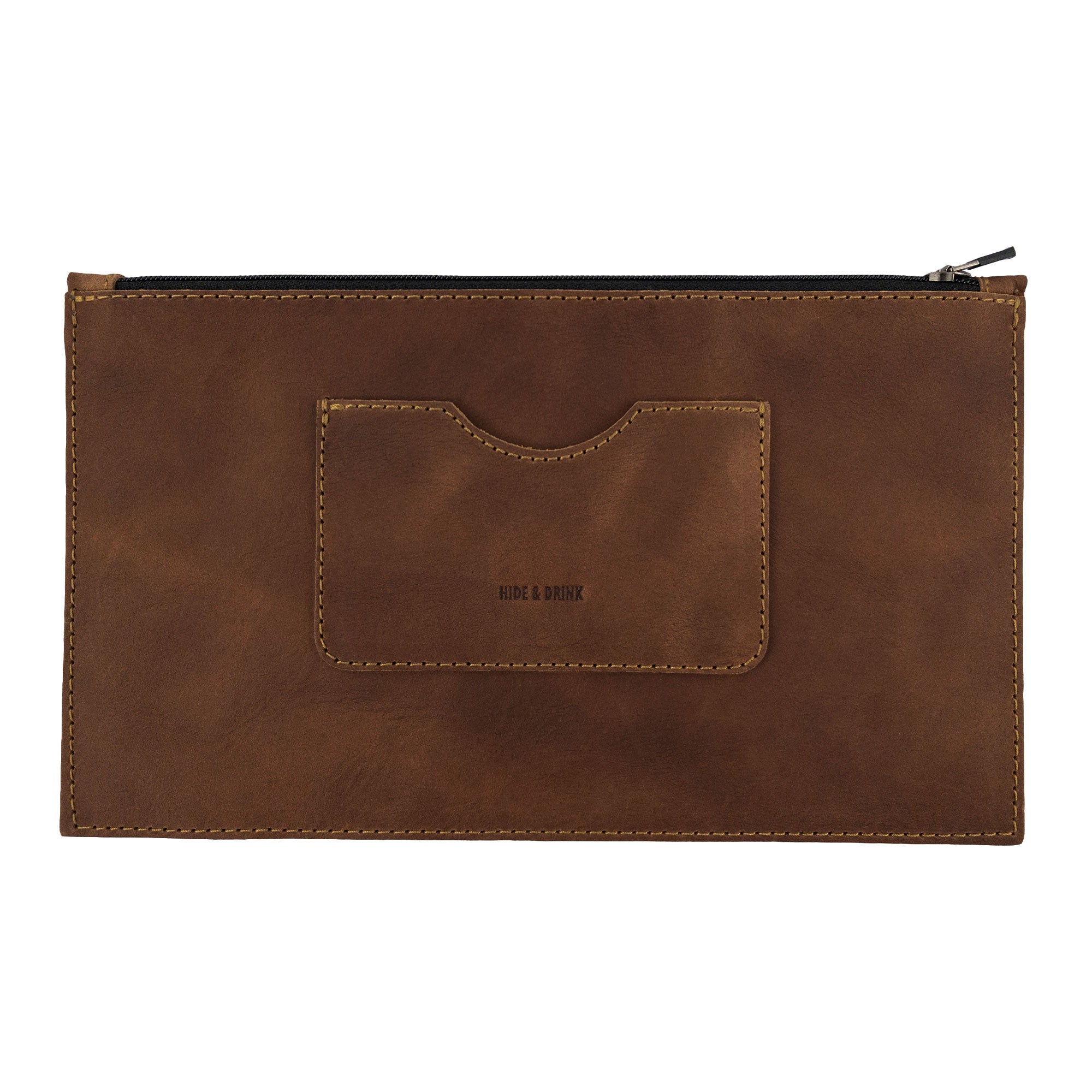 A frontal view of a brown rectangular zippered handbag by Hide & Drink, perfect for women, showcasing its card slot. Crafted from high-quality full grain leather, this female purse represents artisan craftsmanship through careful small batch production, handmade in La Antigua Guatemala & Oaxaca Mexico.