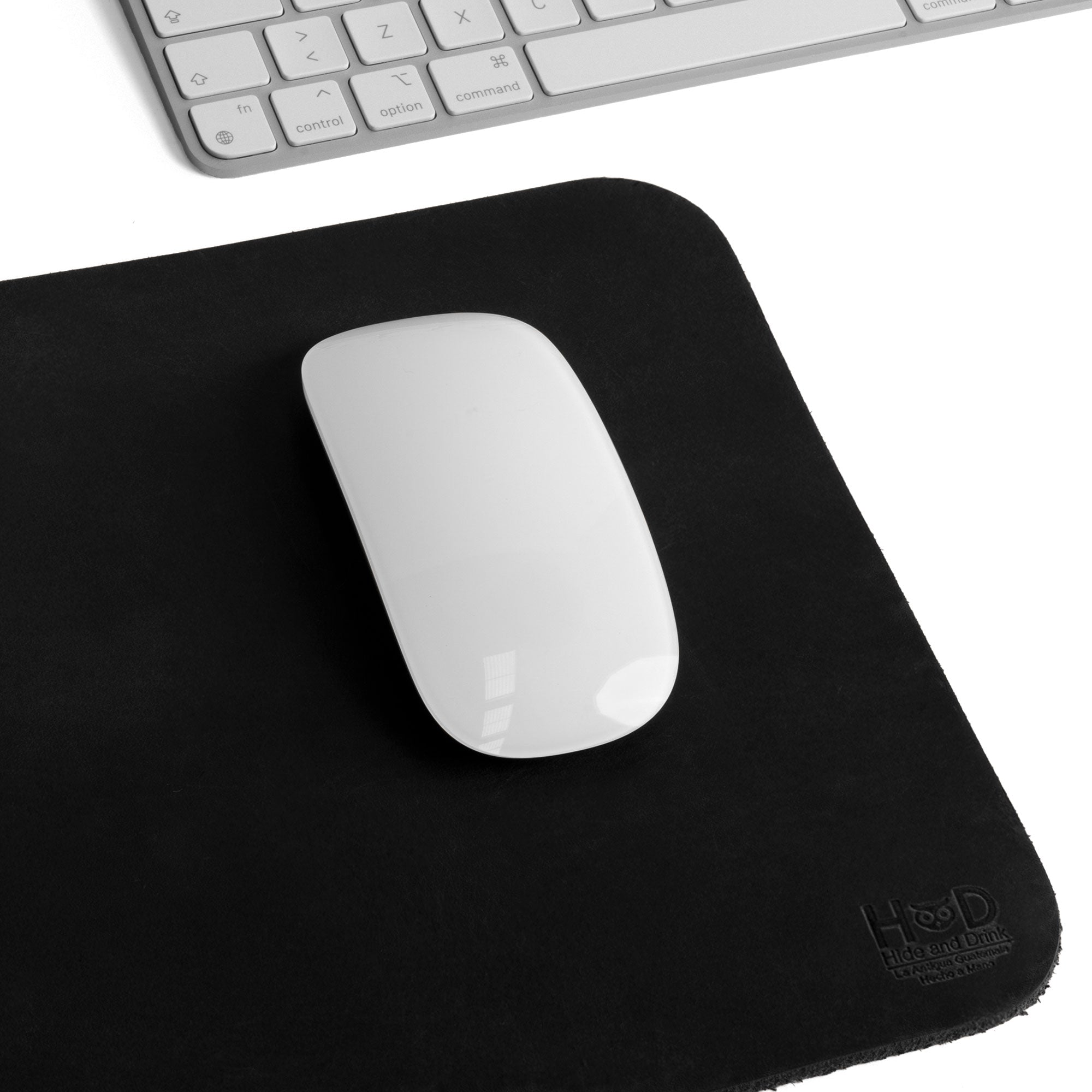 Hide & Drink Mousepad featuring a black textured design that enhances your desktop aesthetics. This artisan-crafted mousepad offers an ergonomic non-slip base for gaming and productivity, made in La Antigua Guatemala & Oaxaca Mexico.