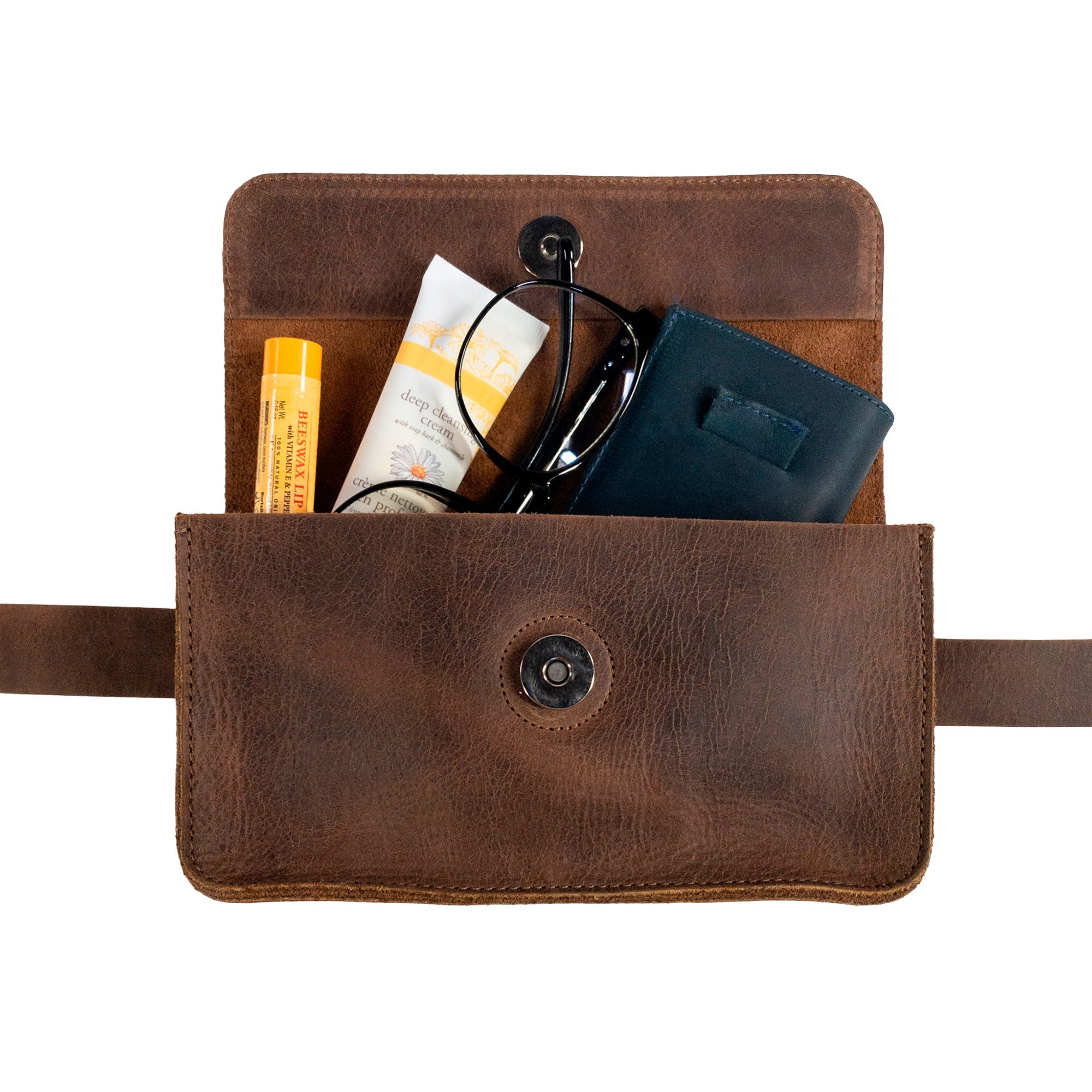 Inside view of Heather's Rectangular Fanny Pack, revealing its spacious design that accommodates essentials. This vintage purse is crafted from full grain leather and features an adjustable strap for a comfy fit. Each fanny pack is handmade in La Antigua Guatemala & Oaxaca Mexico, showcasing artisan craftsmanship.