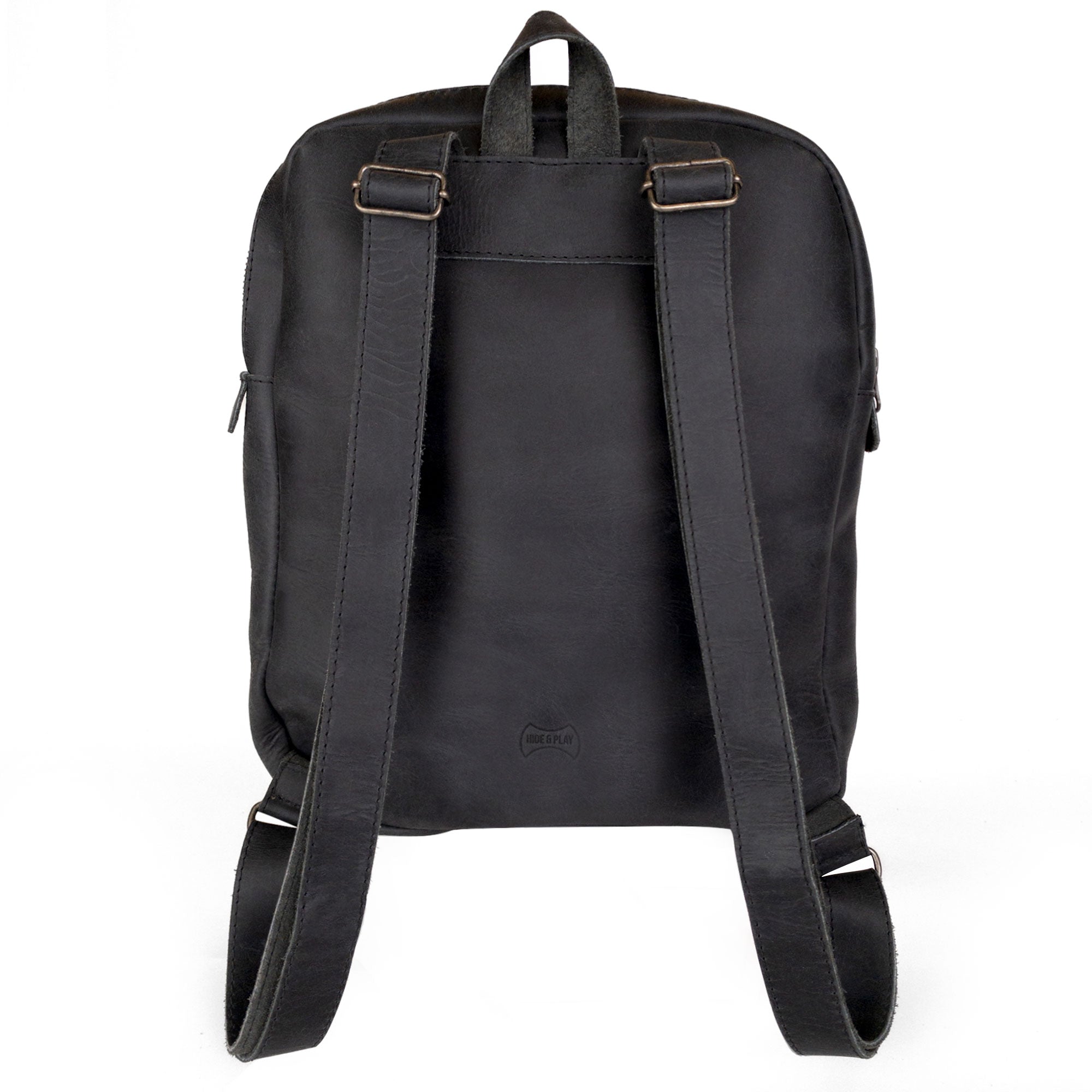 The back view of the Hide & Play Daily Backpack with Unicorn Design, highlighting its sturdy straps and durable full grain leather construction. This casual bag doubles as a messenger bag and travel bag for men and women, designed for everyday wear. Each piece is handcrafted in La Antigua Guatemala, reflecting a commitment to artisan craftsmanship in small batch production.