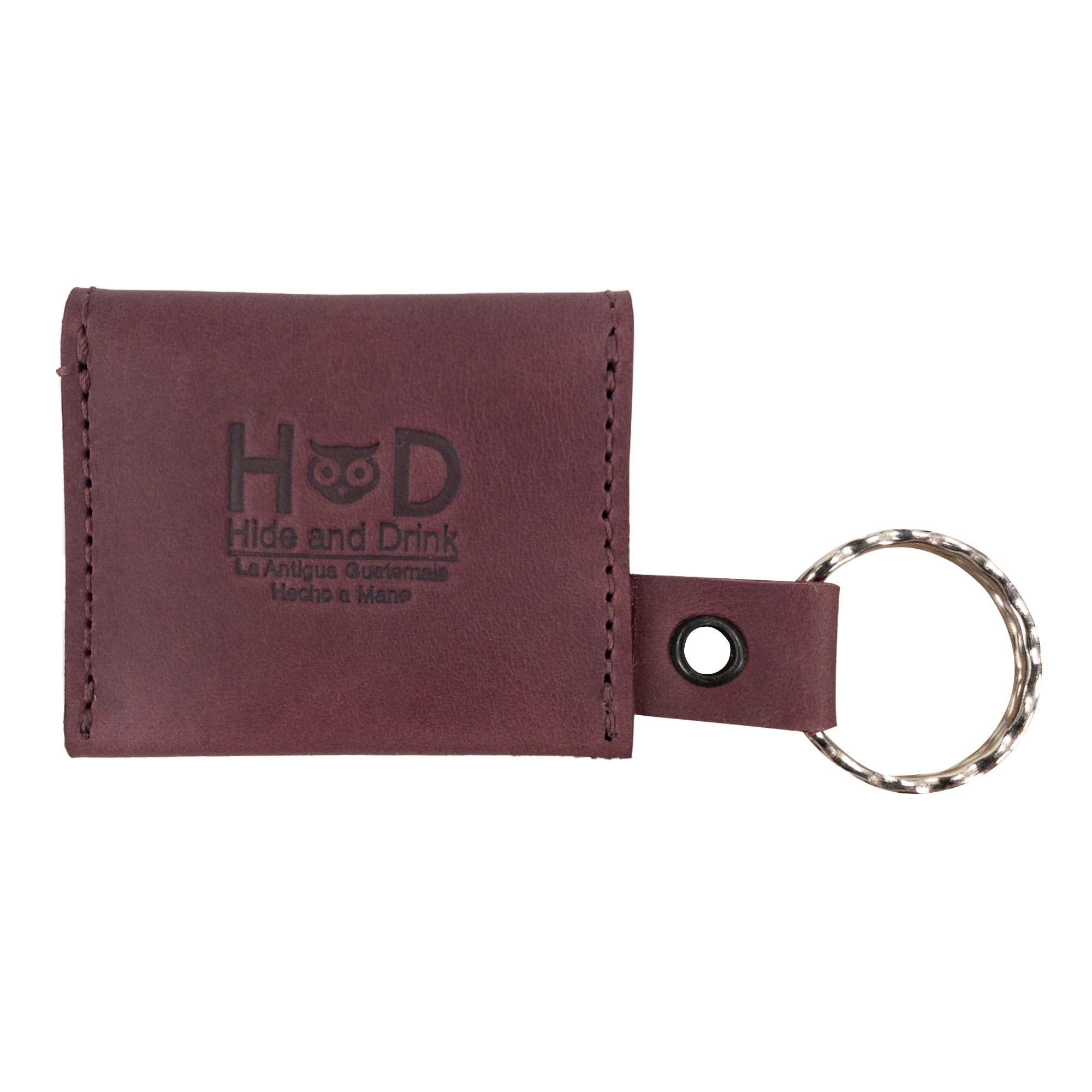 A stylish representation of the Tiny Coin Holder Keychain by Hide & Drink in vibrant leather. This Full Grain Leather Tiny Coin Holder showcases small batch artisan production with a nod to quality craftsmanship.