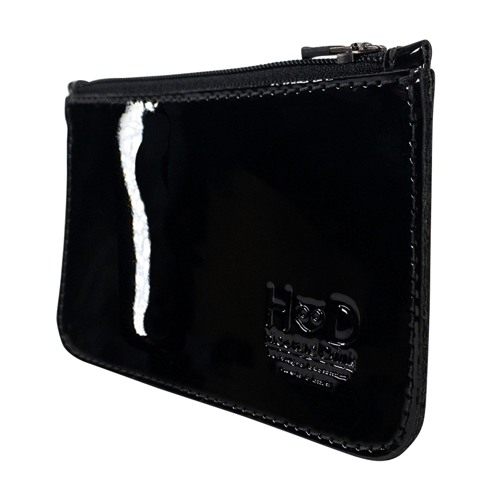 Side profile of the Hide & Drink Zippered Wallet in a glossy black finish, emphasizing the durable craftsmanship. This zippered wallet serves as an elegant card case and folded bills storage, made from high-quality full grain leather with artisan details from La Antigua Guatemala & Oaxaca Mexico.