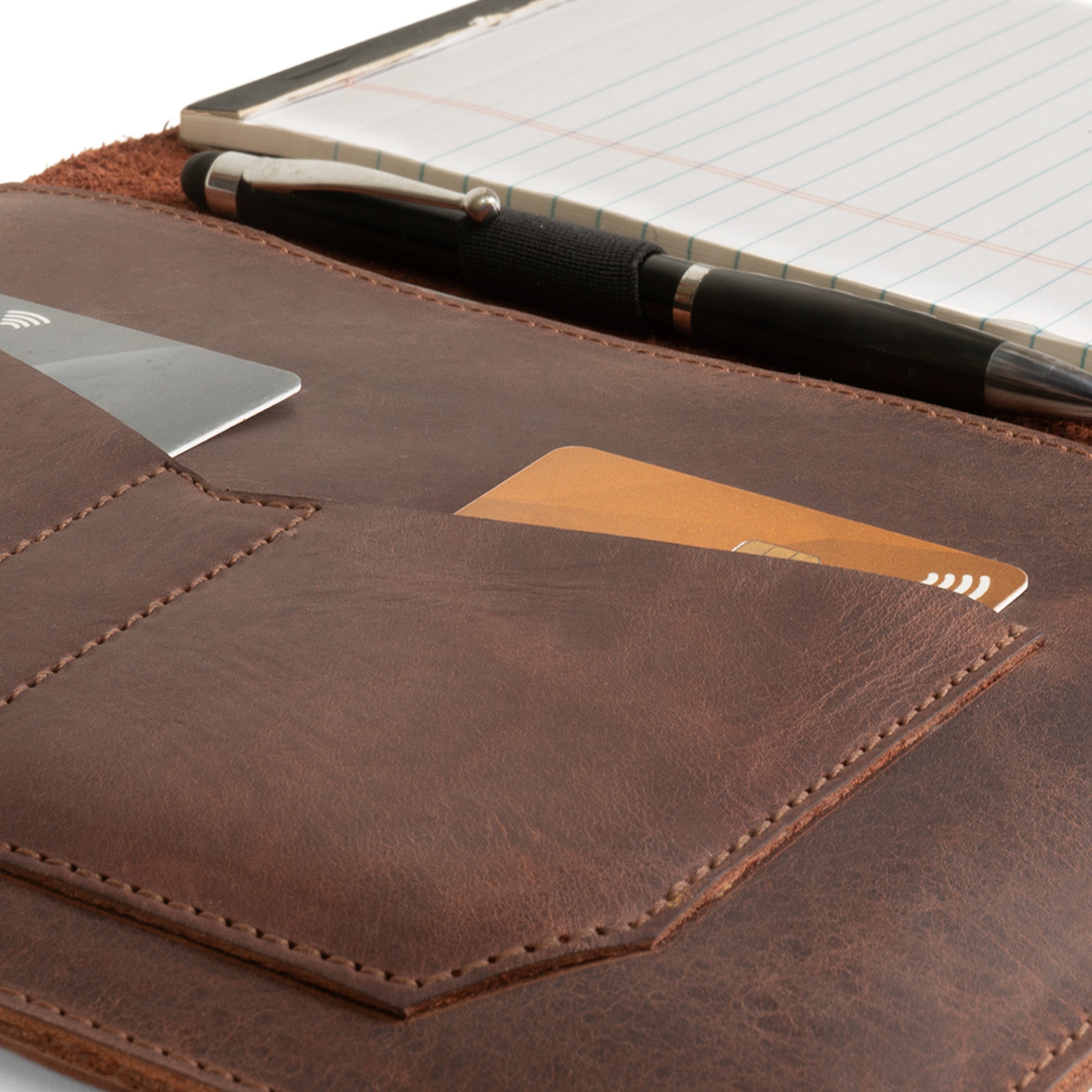 Close-up detail of the Leather Worx Notepad Case 5 x 8 In. showing the card pocket and pen placement, crafted from full grain leather. Notepad Cover (5 x 8 In. Notepad Not Included) Sturdy, Durable Material Perfect for Storing Journal, Full Grain Leather, StockyardX, Small Batch Production, Hand Cut, Hand Sewn, Fire Branded, Artisan, Handmade in La Antigua Guatemala & Oaxaca Mexico.