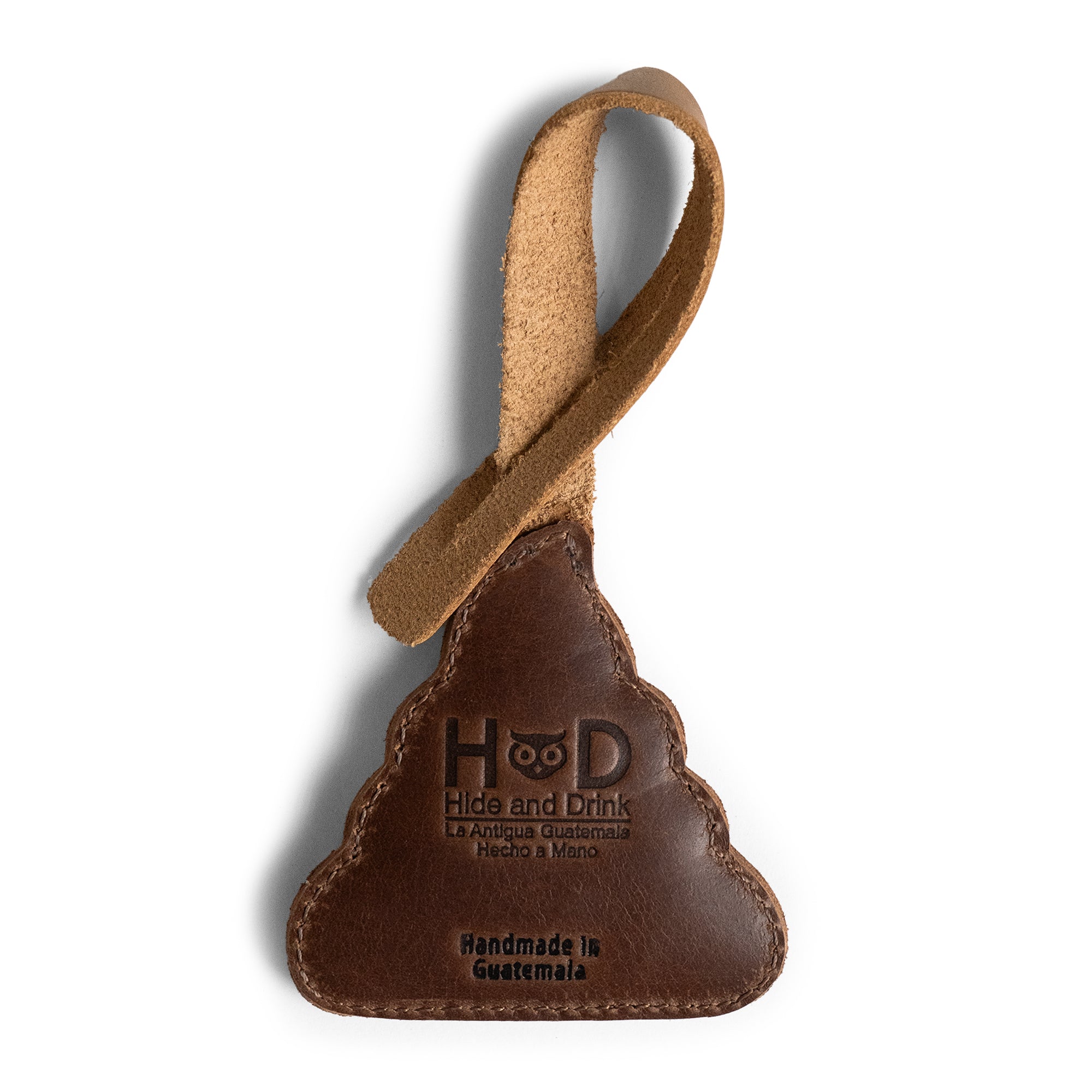 Rear view of the Poop Emoji Bag Charm by Hide & Drink highlighting its leather craftsmanship. Perfect for handbags, purses, and tote bags, this full grain leather charm is hand cut and hand sewn, reflecting artisan techniques and the unique heritage of handmade items from La Antigua Guatemala and Oaxaca Mexico.