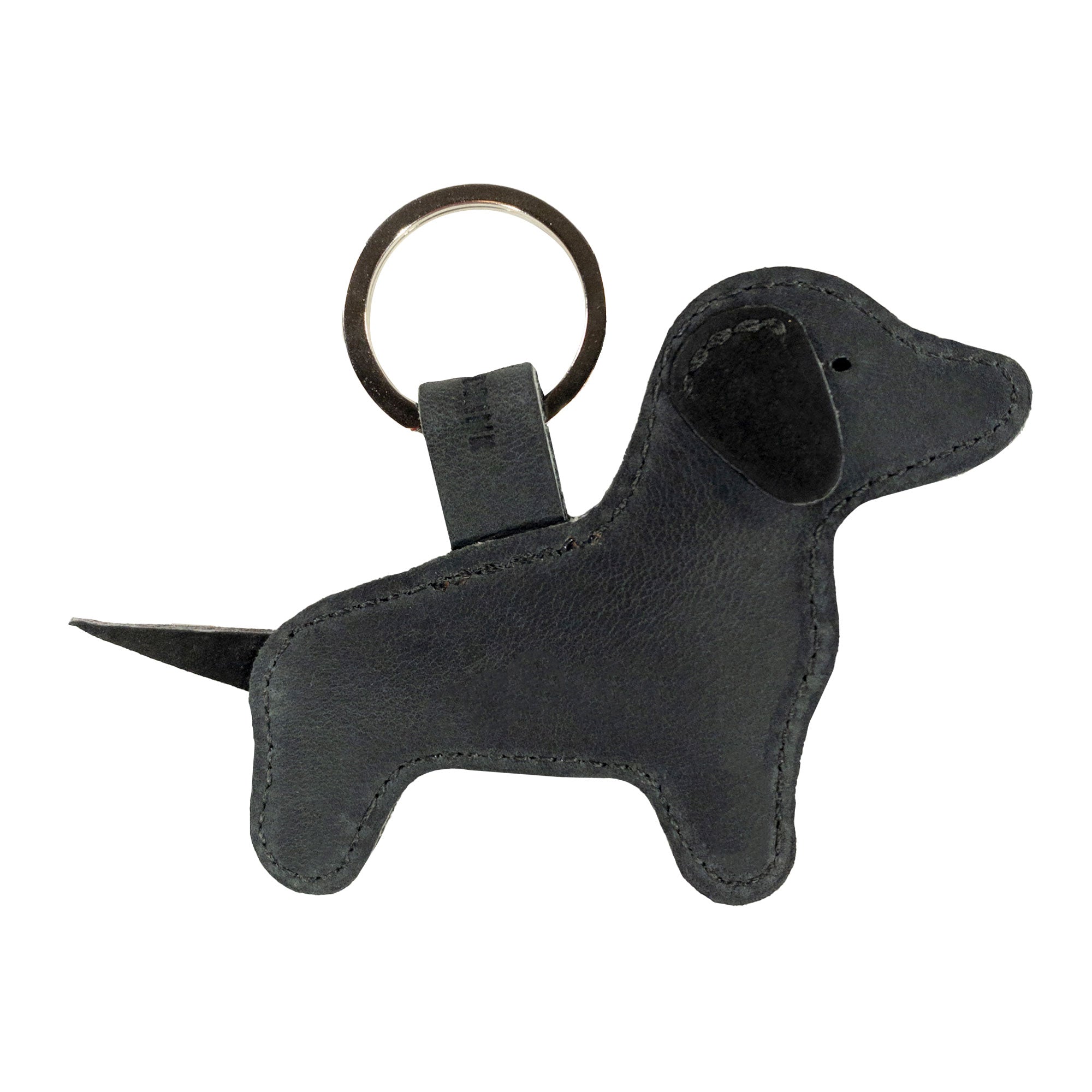 The Hide & Drink Dog Keychain in black leather prominently features its stylish shape and craftsmanship. This cute dog-shaped keyring, crafted from Full Grain Leather, represents the excellence of artisan handmade products, produced in small batches in La Antigua Guatemala & Oaxaca Mexico.