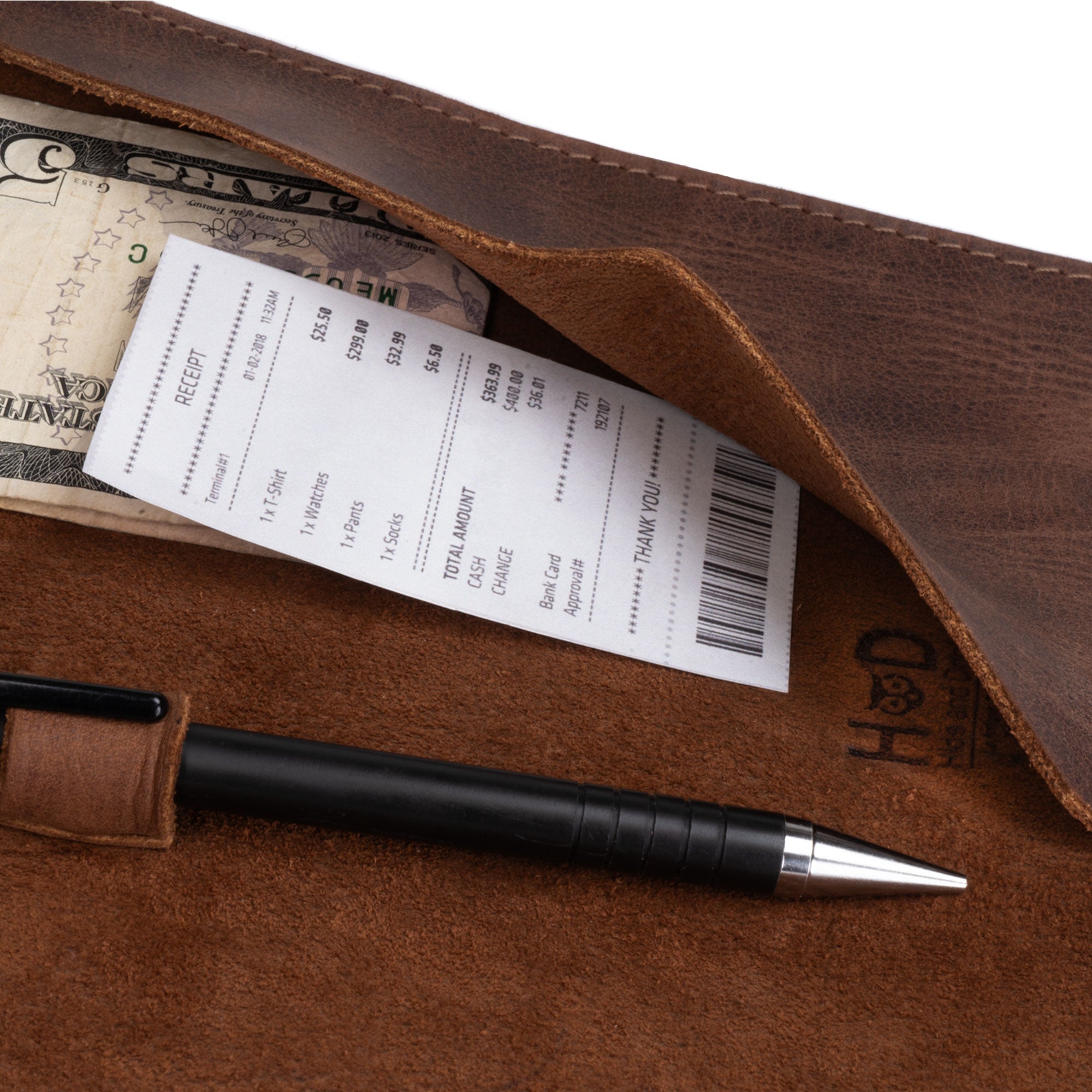 Detail shot of the Bifold Check Presenter With Pen Slot by Hide & Drink, showing cash and receipts neatly placed within the leather. This item is crafted for those who appreciate quality in their restaurant accessories. Bifold Check Presenter with Pen Slot for Restaurant & Cafe Accessories, Western Bill Holder, Full Grain Leather, Handmade Waiter and Waitress Accessory, Small Batch Production, Hand Cut, Hand Sewn, Fire Branded, Artisan, Handmade in La Antigua Guatemala & Oaxaca Mexico.