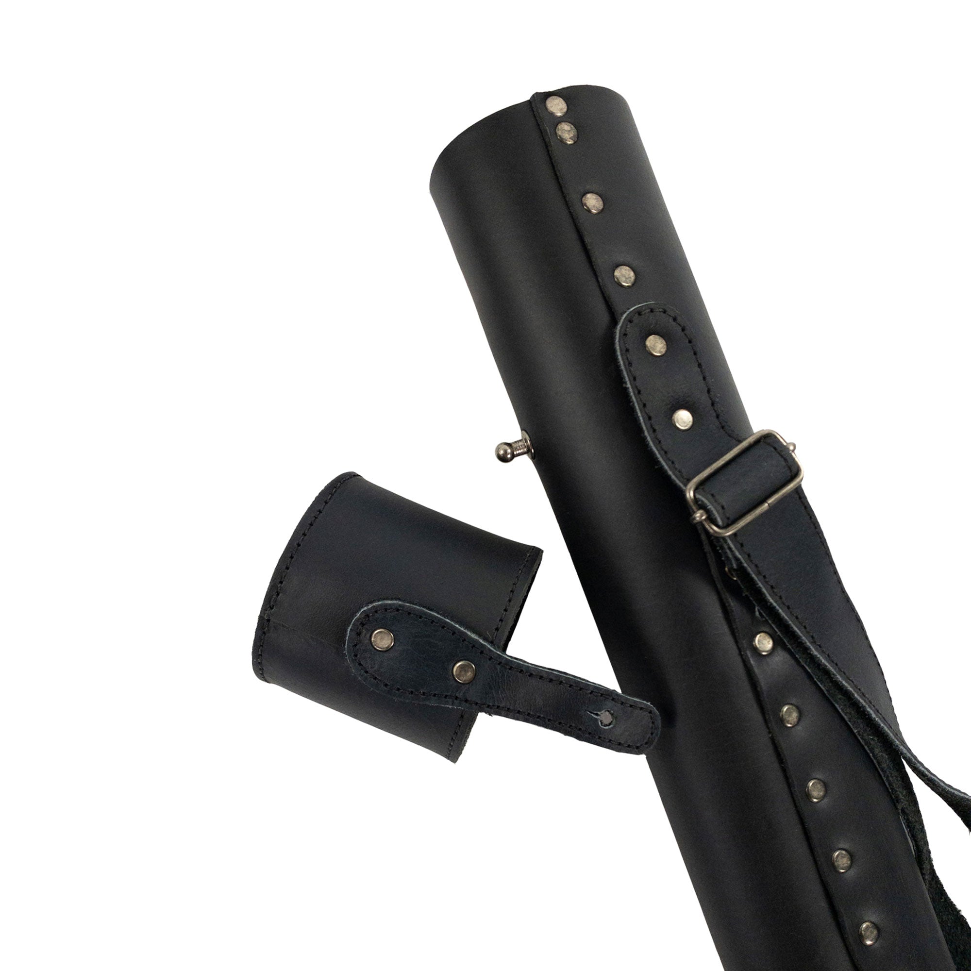 Hide & Drink's Blueprint Tube (A2 Paper Size) elegantly positioned alongside architectural designs. This full grain leather document storage tube with an adjustable strap showcases artisan quality, emphasizing StockyardX’s handmade production in La Antigua Guatemala & Oaxaca Mexico.