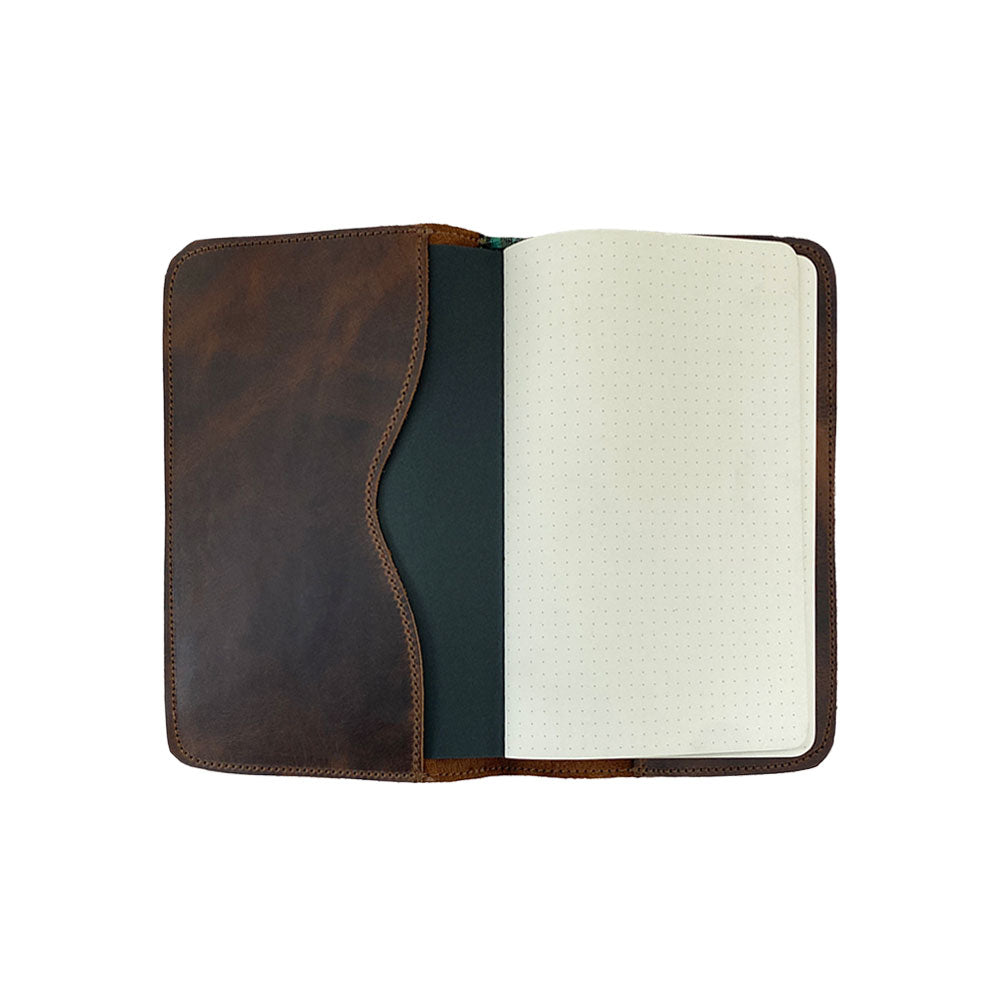 Inside view of the Journal Cover for Moleskine Cahier L (5 x 8.25 in.) showcasing a smooth black interior made by Hide & Drink. This refillable journal cover, designed for large size (5 x 8.25 in.) notebooks, is a beautiful full grain leather rustic protector, made in small batches.