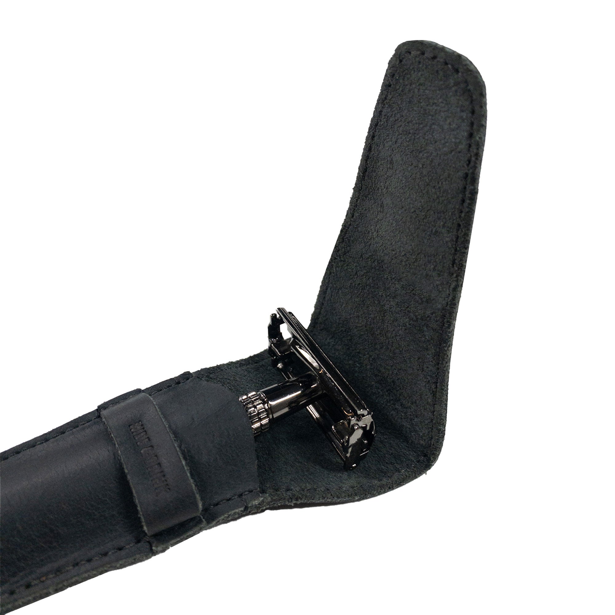 A close-up of the interior of the black Safety Razor Case by Hide & Drink, featuring a soft lining for razor protection. This handmade case, made from full grain leather, is ideal for personal care and shaving accessories, handcrafted in La Antigua Guatemala and Oaxaca Mexico.