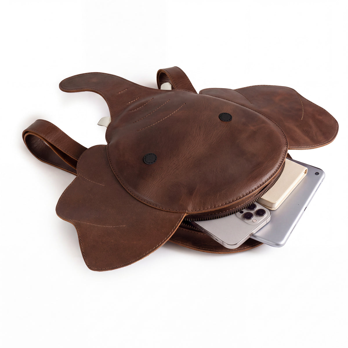 Interior view of the Elephant-Shaped Backpack made by Hide & Play, featuring ample space and quality craftsmanship. This Elephant-Shaped Shoulder Bag is designed from Full Grain Leather, making it a perfect Travel Bag for Men and Women. The small batch production at StockyardX highlights handmade artistry in each piece.