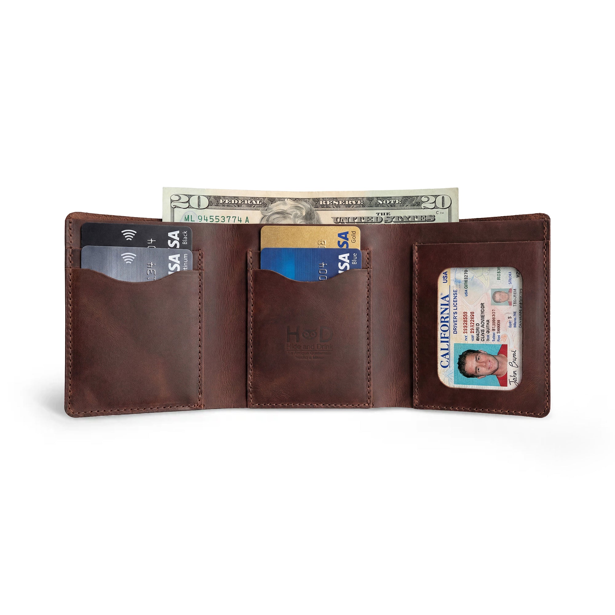 The Classic Trifold Wallet by Hide & Drink open, holding cards and cash, showcasing Full Grain Leather craftsmanship. This wallet highlights the unique artisan skill from Small Batch Production in La Antigua Guatemala & Oaxaca, Mexico.