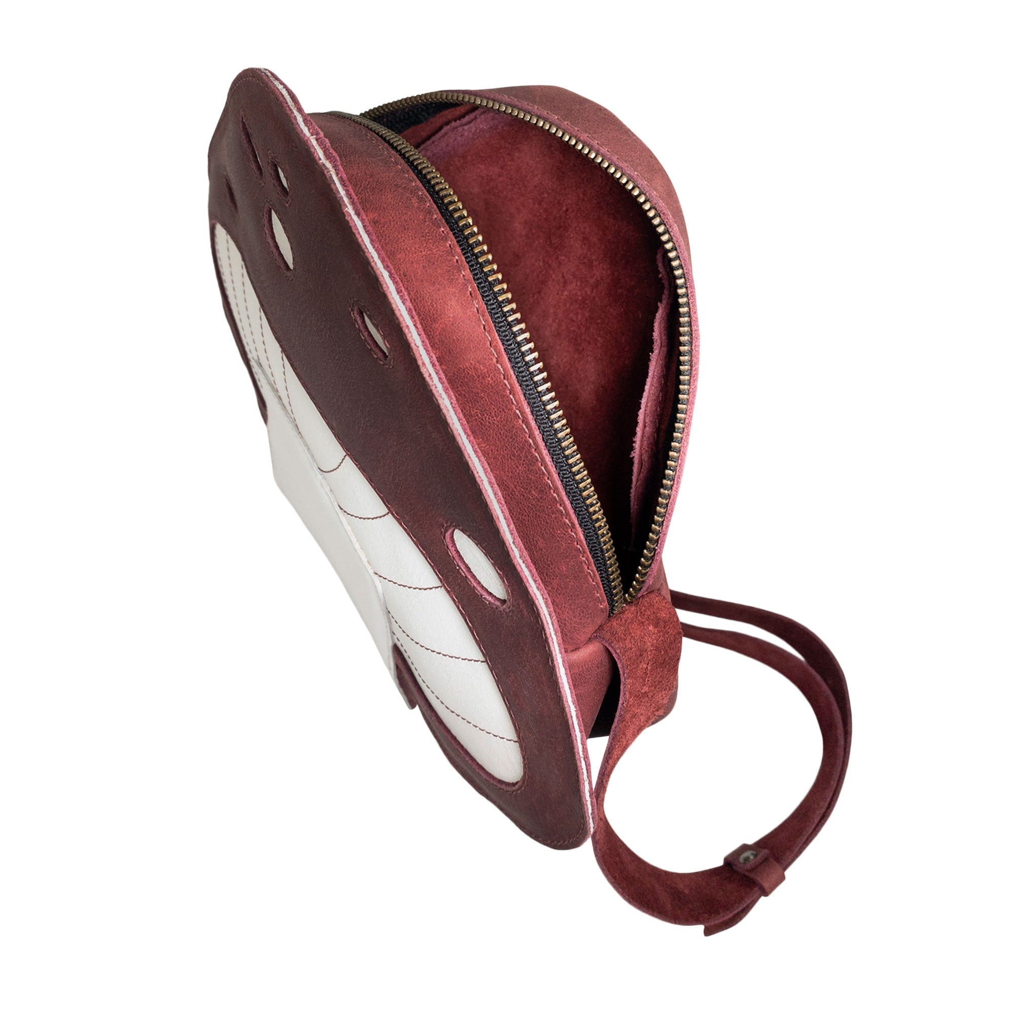 An inside view of the Mushroom-Shaped Leather Shoulder Bag by Tudi Frudi, highlighting its quality craftsmanship. This bag is perfect for daily use as a crossbody or travel bag, made from Full Grain Leather with small batch production techniques. Artisan handcrafted in La Antigua Guatemala, ensuring a unique touch.