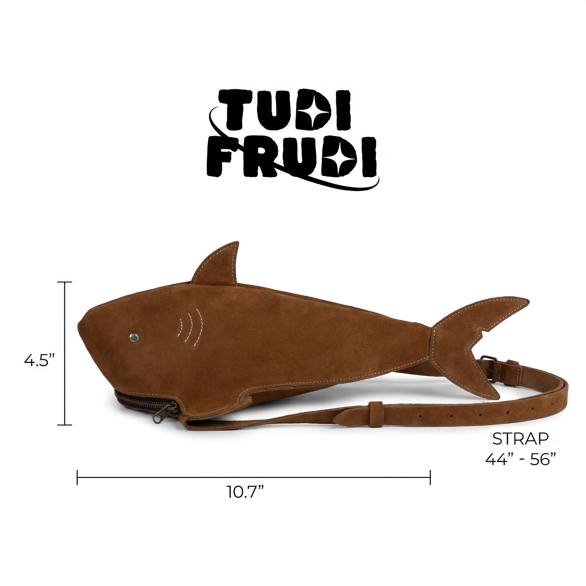 Dimensions and branding of the Shark-Shaped Shoulder Bag by Tudi Frudi, shown with measurements. This bag combines fashion with functionality, crafted from Full Grain Leather and made in La Antigua Guatemala. The adjustable strap allows for crossbody or messenger style wear. A true artisan piece, it features hand cut and hand sewn details, reflecting small batch production.
