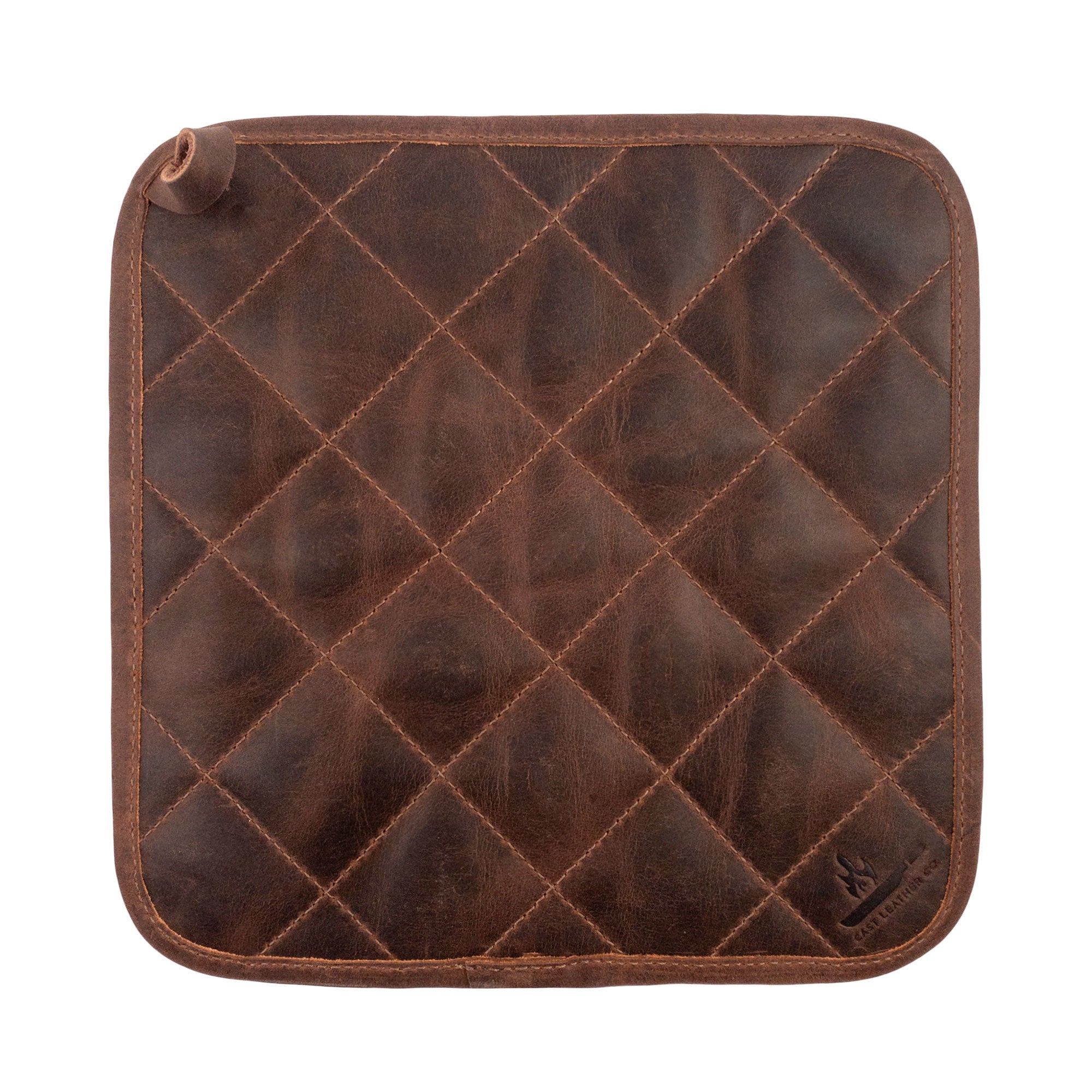 The Cast Leather Co. Squared Hot Pot Pad displayed flat, highlighting its durable design. This Squared Oven Mitt Heat Resistant, Hot Pot Pad (Potholder) is ideal for bakery supplies, made from premium full grain leather and sheepskin. Each piece is hand cut, hand sewn, fire branded, and celebrates small batch production, crafted by artisans in La Antigua Guatemala & Oaxaca Mexico.