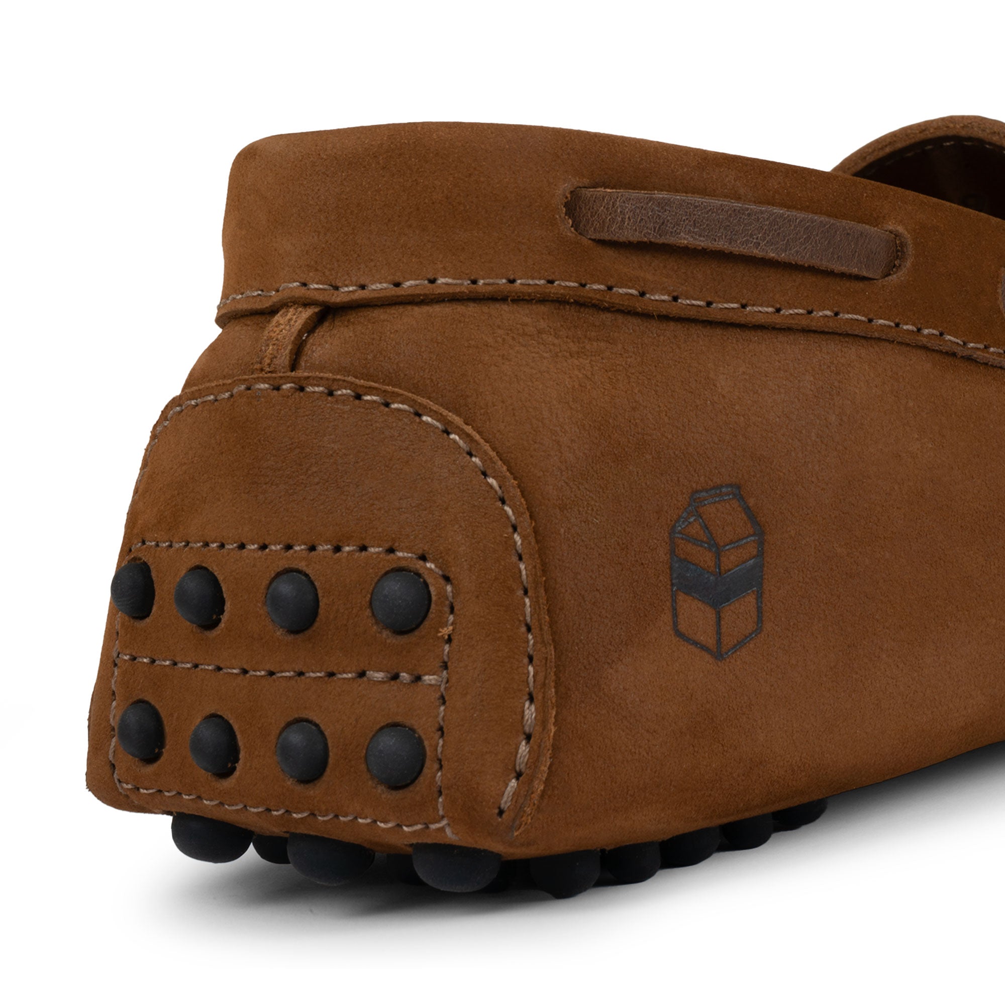 Back view of The Roadster Leather Driving Moccasins by La Leche, detailing the durable rubber sole and Full Grain Leather construction, emphasizing the artisan's small batch production, handcrafted in La Antigua Guatemala & Oaxaca Mexico.