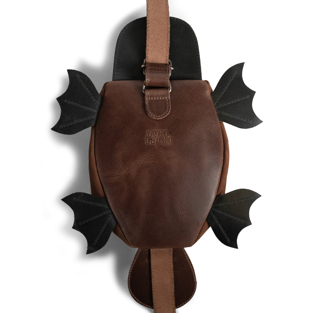 Back view of the Tudi Frudi Platypurse Crossbody Bag showing its brown Full Grain Leather body, black platypus-inspired wings and tail, Adjustable Shoulder Strap, Messenger Bag and Shoulder Bag styling, Zippered Sling Bags function, Travel Backpack versatility, Purses for Men and Women appeal, Satchel design, Swayze Suede finish, StockyardX Small Batch Production, Hand Cut and Hand Sewn Artisan craftsmanship, Fire Branded detail, Handmade in La Antigua Guatemala & Oaxaca Mexico.