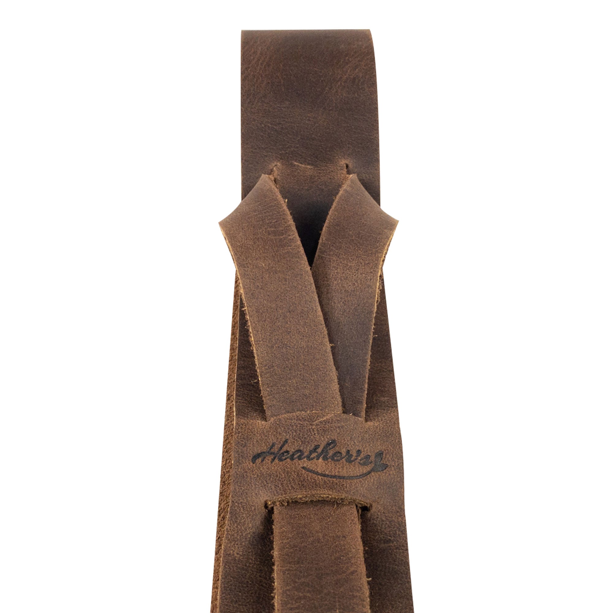 Detailed view of Heather's Fashion Belt for Women emphasizing the artisan craftsmanship, featuring a unique no-buckle closure. Made from high-quality full grain leather, this waist strap accessory is perfect for creating stylish outfits. Fashion Belt for Women without Buckle, No-Buckle Belt, Stylish Belly Accessory, Small Batch Production, Hand Cut, Hand Sewn, Fire Branded, Artisan.