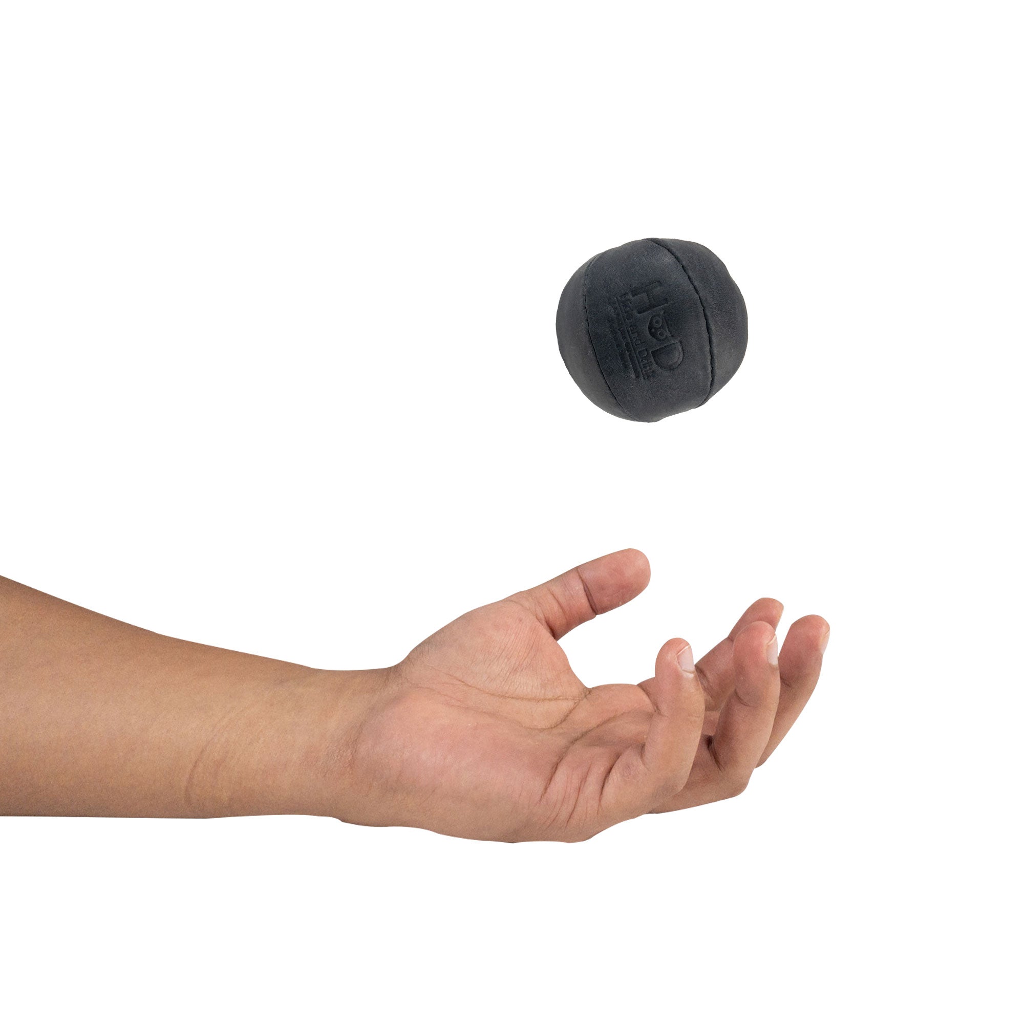 Hide & Drink black Stress Ball caught mid-throw, an excellent choice for relieving fidgeting and anxiety. This squishy tension accessory displays classic design made from full grain leather, artisan crafted in La Antigua Guatemala.