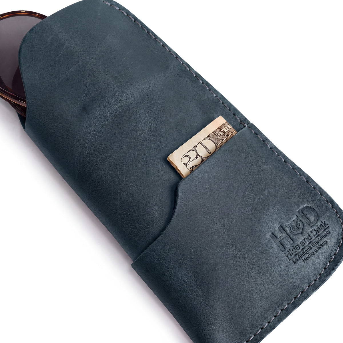 Stylish profile of the Hide & Drink Sunglass Case & Wallet, emphasizing its handcrafted quality. This Rustic Sunglasses Case & Wallet features Full Grain Leather for a luxurious feel while offering great protection for your eyeglasses during travel, artisanal nods from La Antigua Guatemala & Oaxaca Mexico.