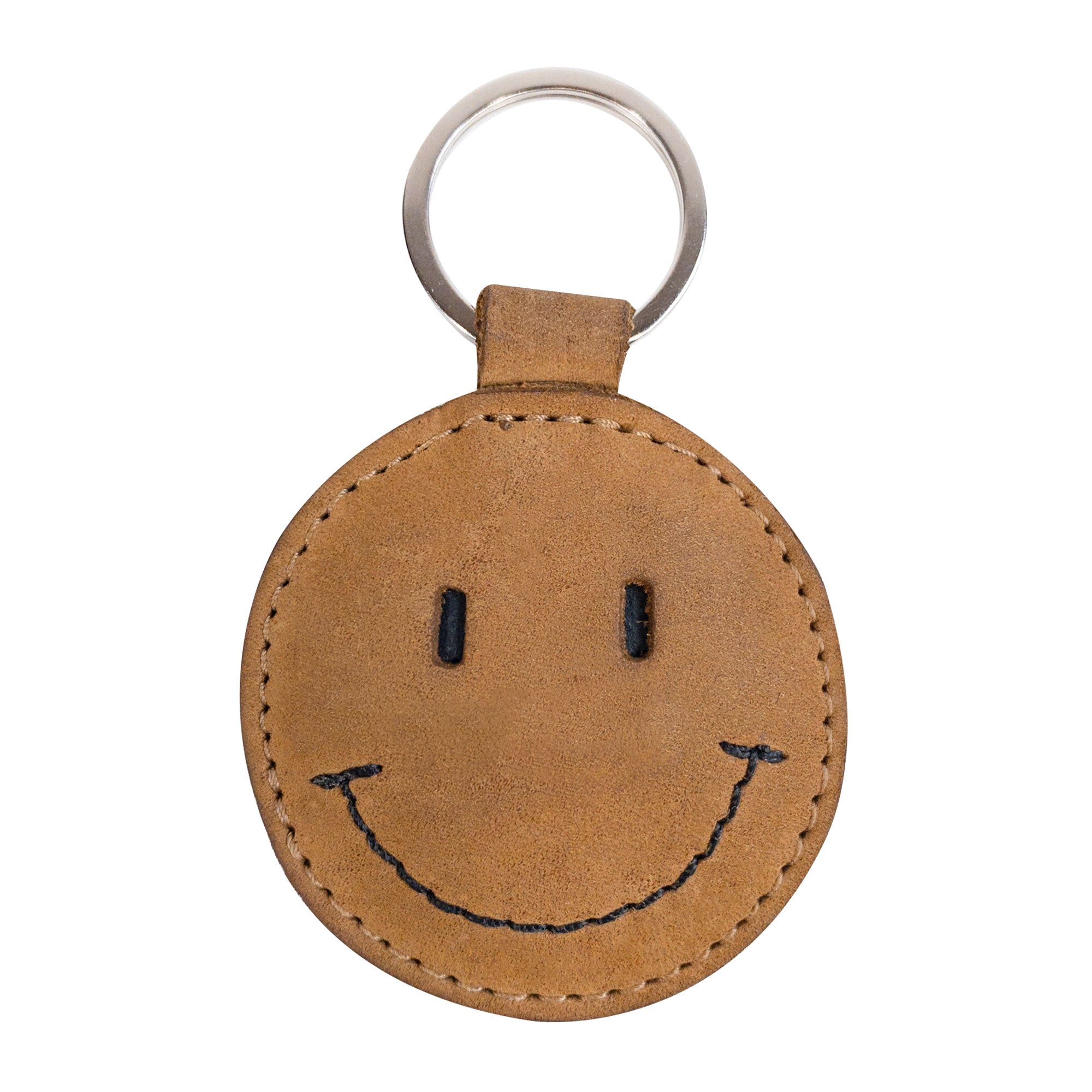 Front view of the Smiley Face Keychain by Hide & Drink featuring its cheerful smile design. Made from quality Full Grain Leather, this key holder combines fun with functionality. An excellent gift choice for various occasions, showcasing handmade artisan care from Oaxaca Mexico.