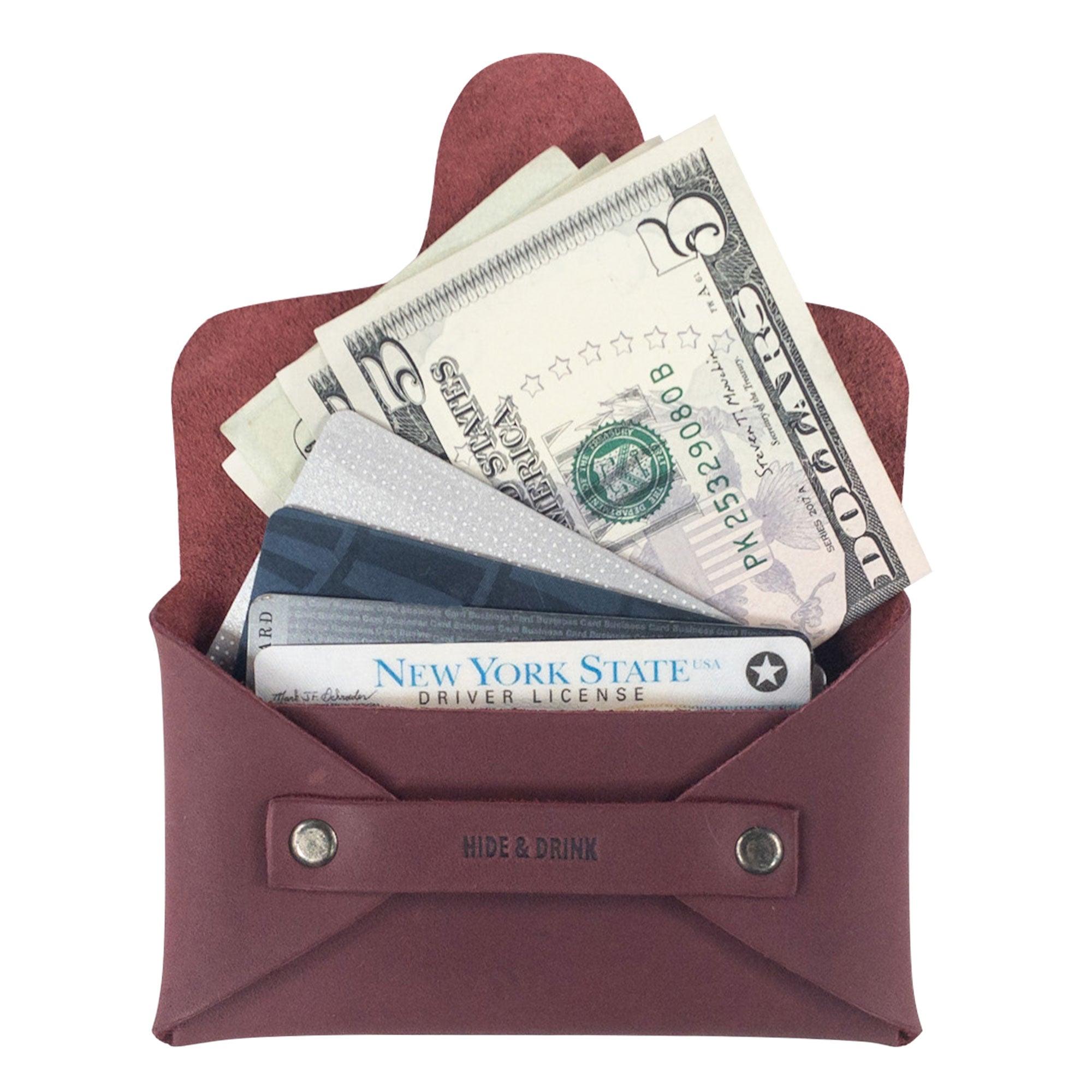 Hide & Drink's Snapless Business Card Holder featuring money and cards. This stylish and practical wallet is a perfect Snapless Business Card Holder for Men and Women, serving as a sturdy pouch and money organizer. Made from Full Grain Leather, it's part of StockyardX's collection highlighting small batch production, hand cut, hand sewn, and fire branded artisan work made in La Antigua Guatemala & Oaxaca Mexico.