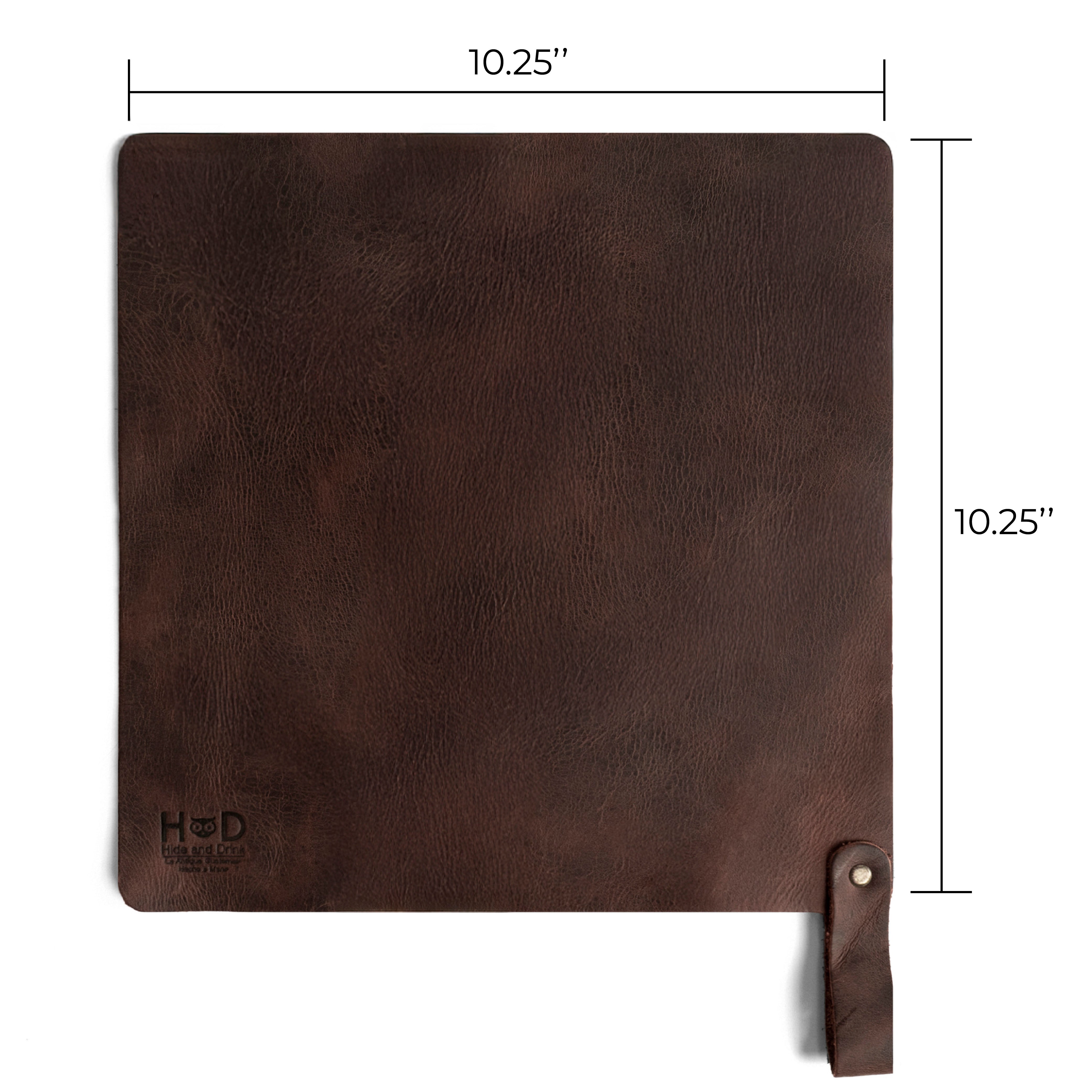 Showcasing the dimensions of Hide & Drink's Potholder Sheet, this image highlights its perfect sizing for practical use. Made from full grain leather, this Squared Potholder Sheet is designed for home essentials, combining hand cut and hand sewn techniques that reflect artisan skills from La Antigua Guatemala & Oaxaca Mexico. Ideal for all cookware.