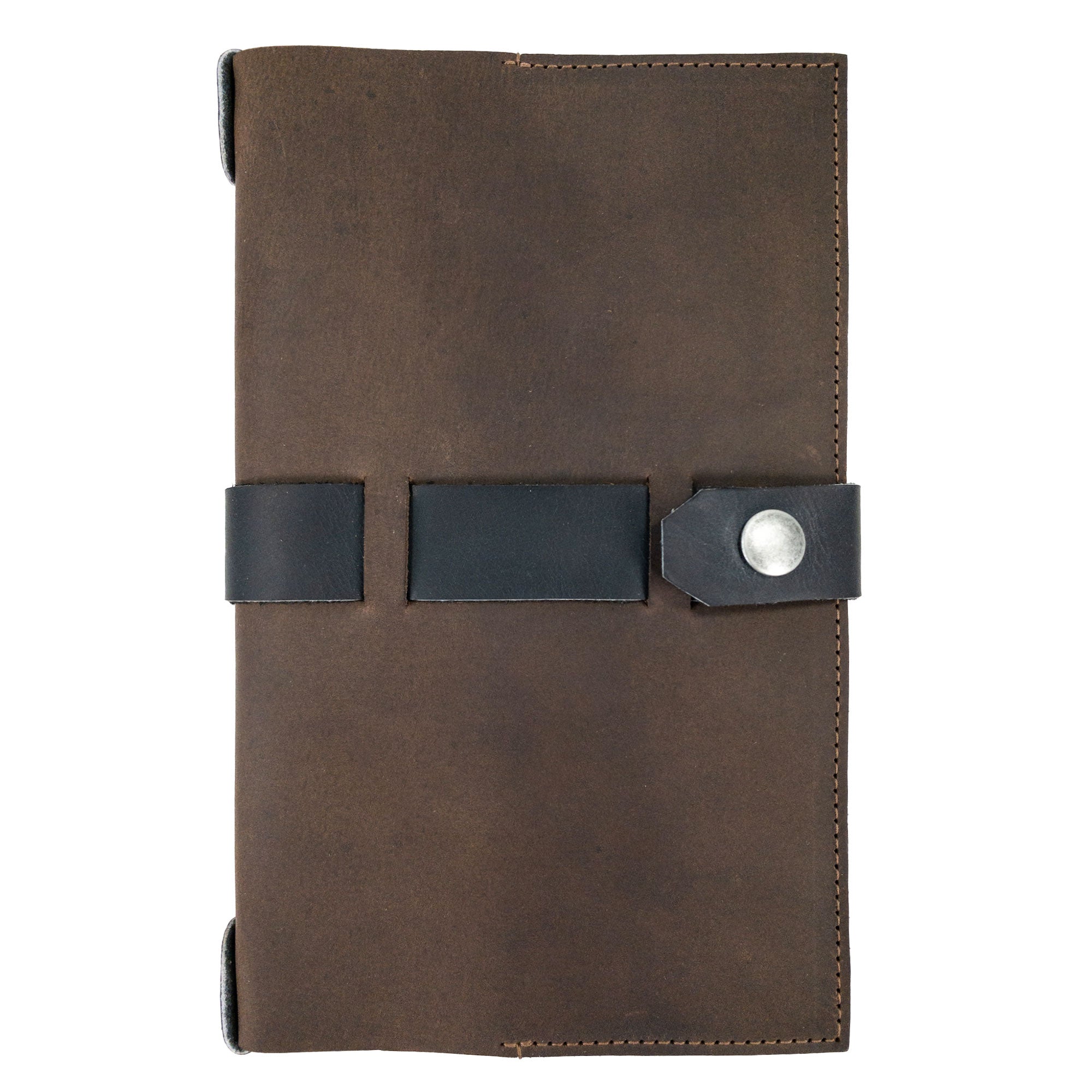Elegant closure view of Hide & Drink's Riveted Field Note Cover for Moleskine (5 x 8.25 in.) Notebook NOT Included, crafted from premium brown leather. This artisan product showcases quality handmade techniques from La Antigua Guatemala & Oaxaca, Mexico.