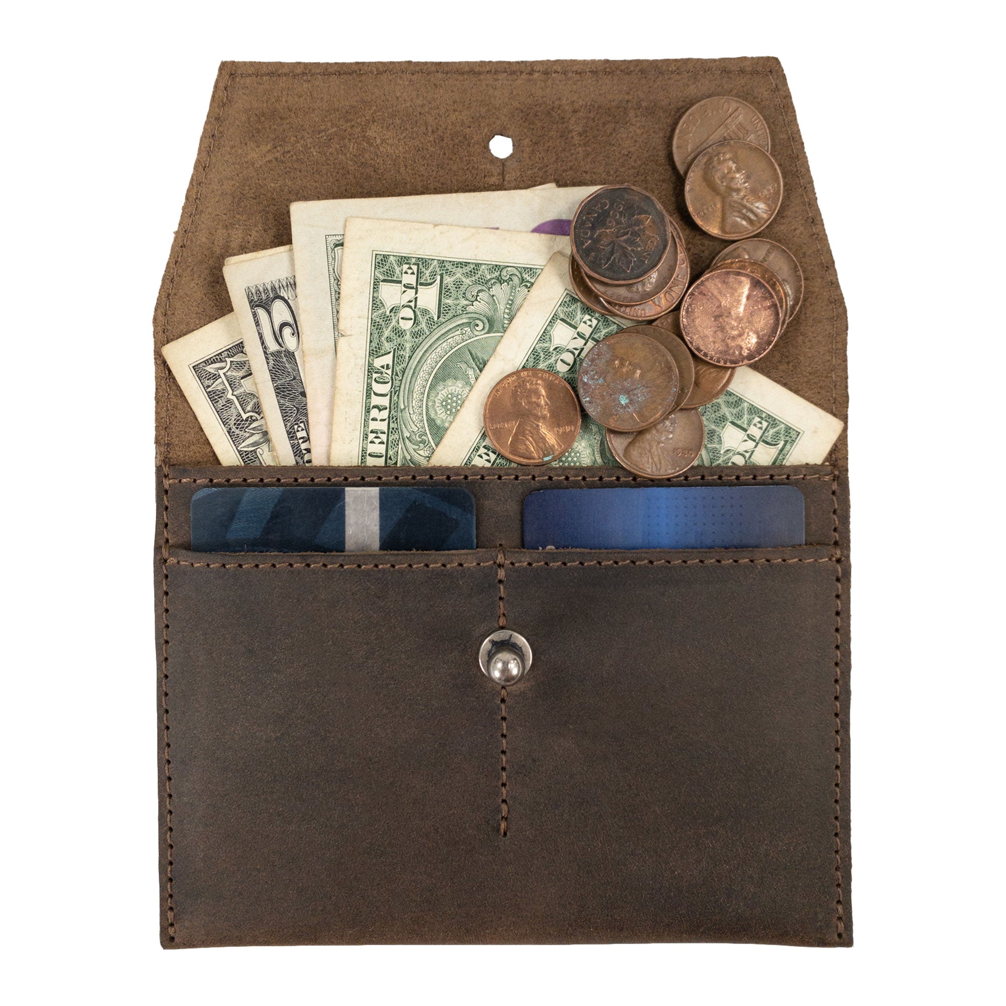 Hide & Drink Minimalist Wallet filled with cash and coins, illustrating its functionality as a durable cash organizer. Crafted from full grain leather, this handmade wallet combines artistry and practicality, produced through small batch methods in La Antigua Guatemala & Oaxaca Mexico.