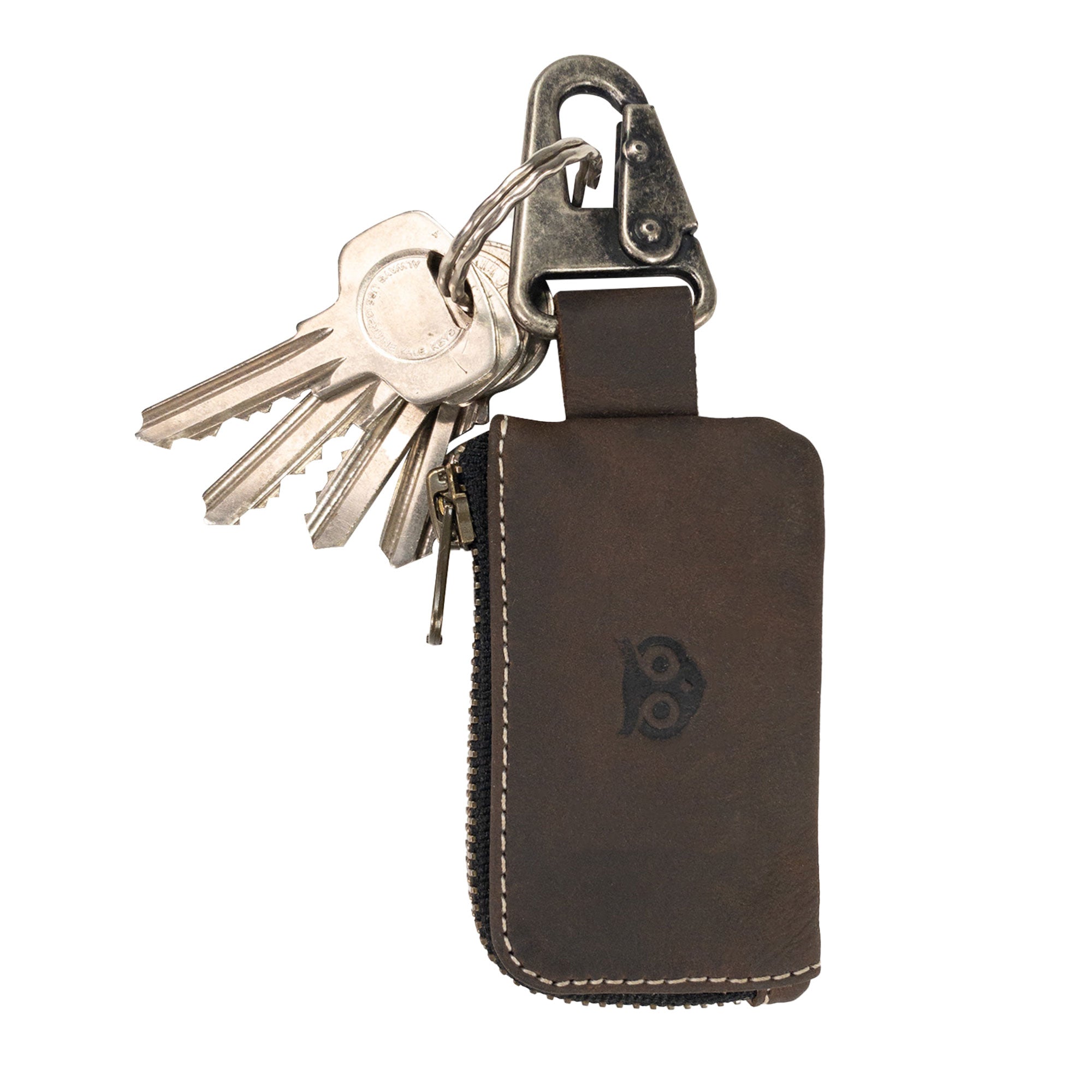 Brown Car Key Holder by Hide & Drink, showcasing its utility in securely holding keys and cash, as well as functionality for Headphone and charging Cables, Memory Cards, and Flash Drives. This artisan piece is made from high-quality Full Grain Leather and features a Nickel Metal Clasp, exemplifying Small Batch Production in La Antigua Guatemala & Oaxaca Mexico.