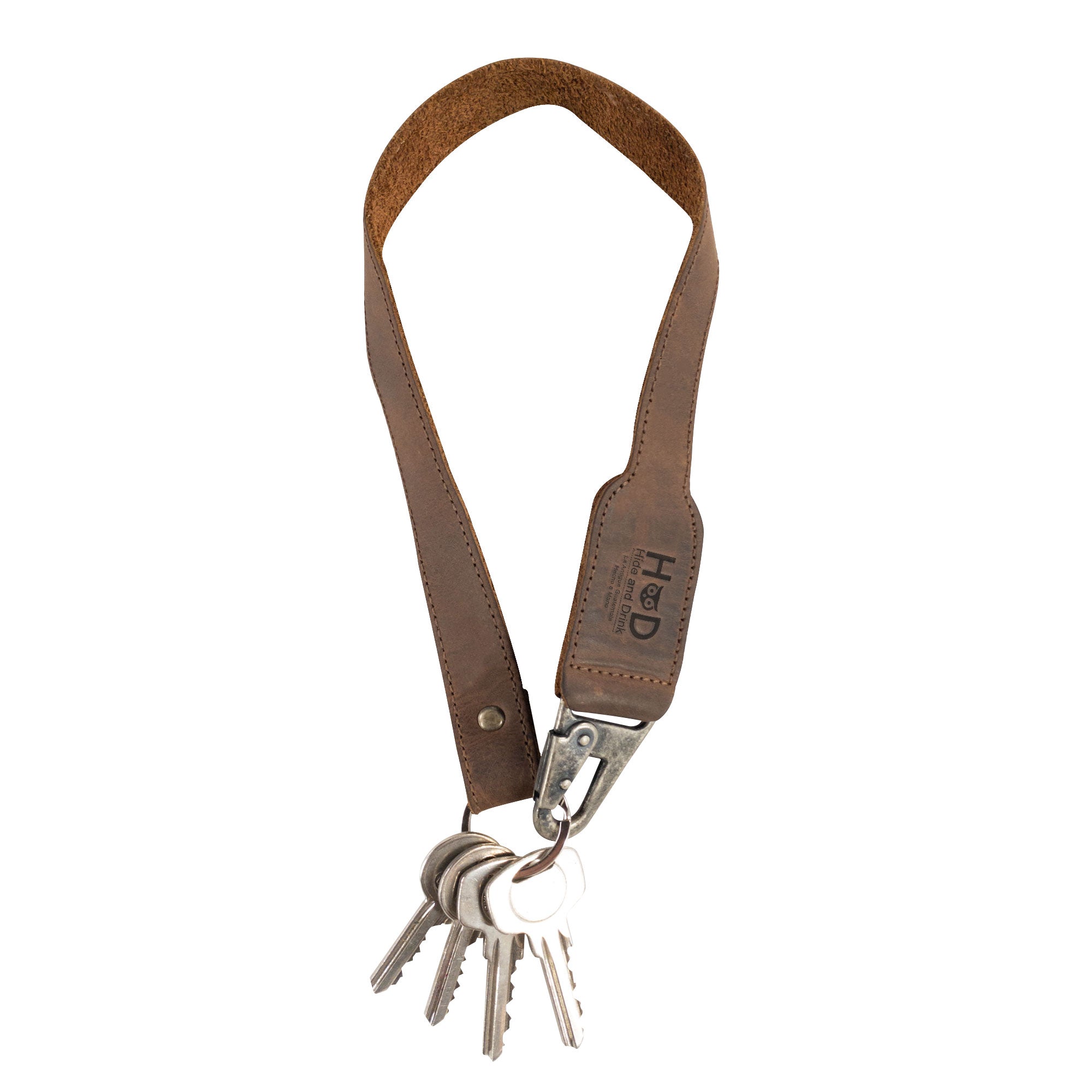 Hide & Drink Keychain Lanyard with a chic design, made of premium Full Grain Leather. The clip allows easy attachment to house, car, and apartment keys, highlighting the artisan craftsmanship and small batch production ethos.