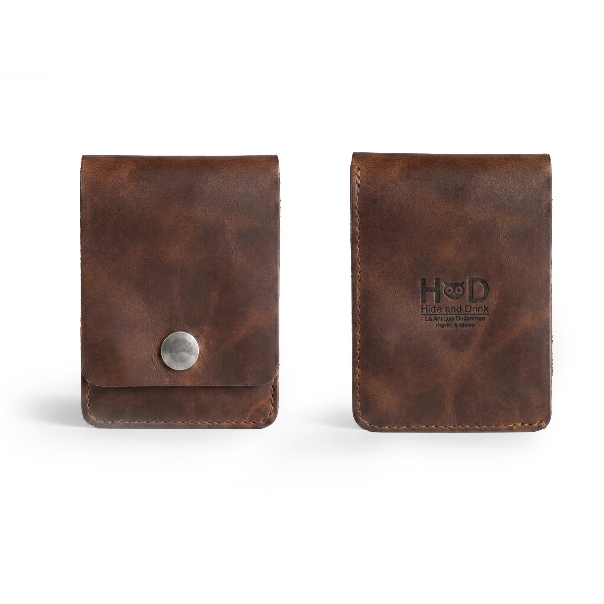 Back view of the Vertical Wallet by Hide & Drink featuring the brand logo embossed on high-quality leather. This Vertical Front Pocket Wallet with Card Slot combines compact storage for bills and card holder functionality, showcasing the craftsmanship of small batch production, hand cut, and hand sewn goods by artisans, fire branded. Handmade in La Antigua Guatemala & Oaxaca Mexico.