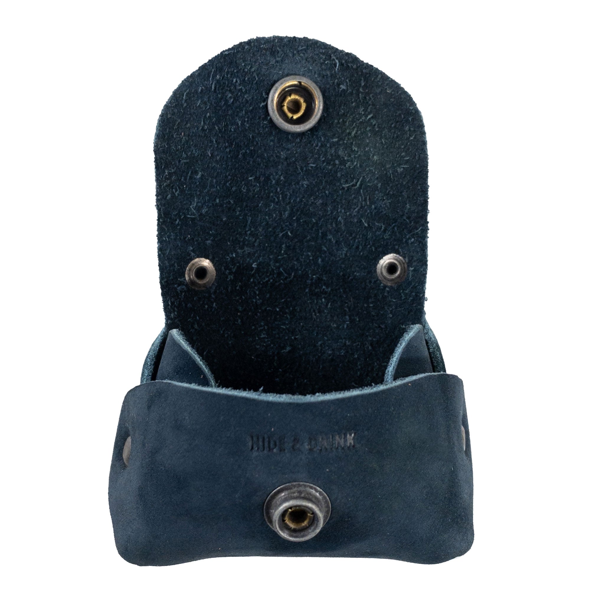 Back view of the Tiny Handbag Keychain by Hide & Drink, emphasizing its structural design and craftsmanship. This Tiny Handbag with Key Ring Holder is made from Full Grain Leather, highlighting its small batch production, hand cut and hand sewn work, fire branded, and handcrafted in La Antigua Guatemala & Oaxaca Mexico.