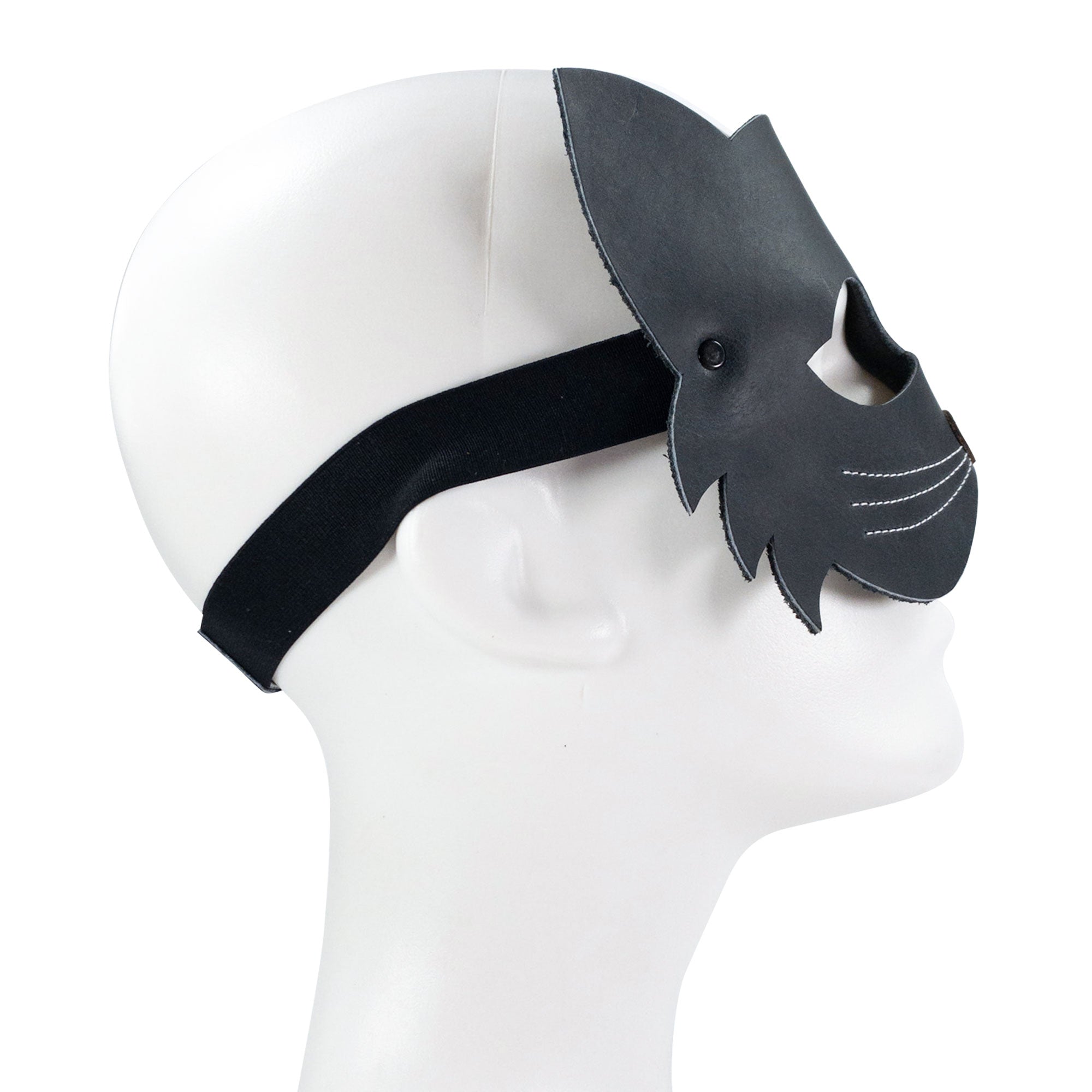 Side profile of the Cat Shape Face Mask from Hide & Play, emphasizing its comfortable fit and detailed craftsmanship in full grain leather. This handmade accessory is perfect for any cat lover, produced through small batch methods in La Antigua Guatemala, with careful attention to hand cutting and sewing.
