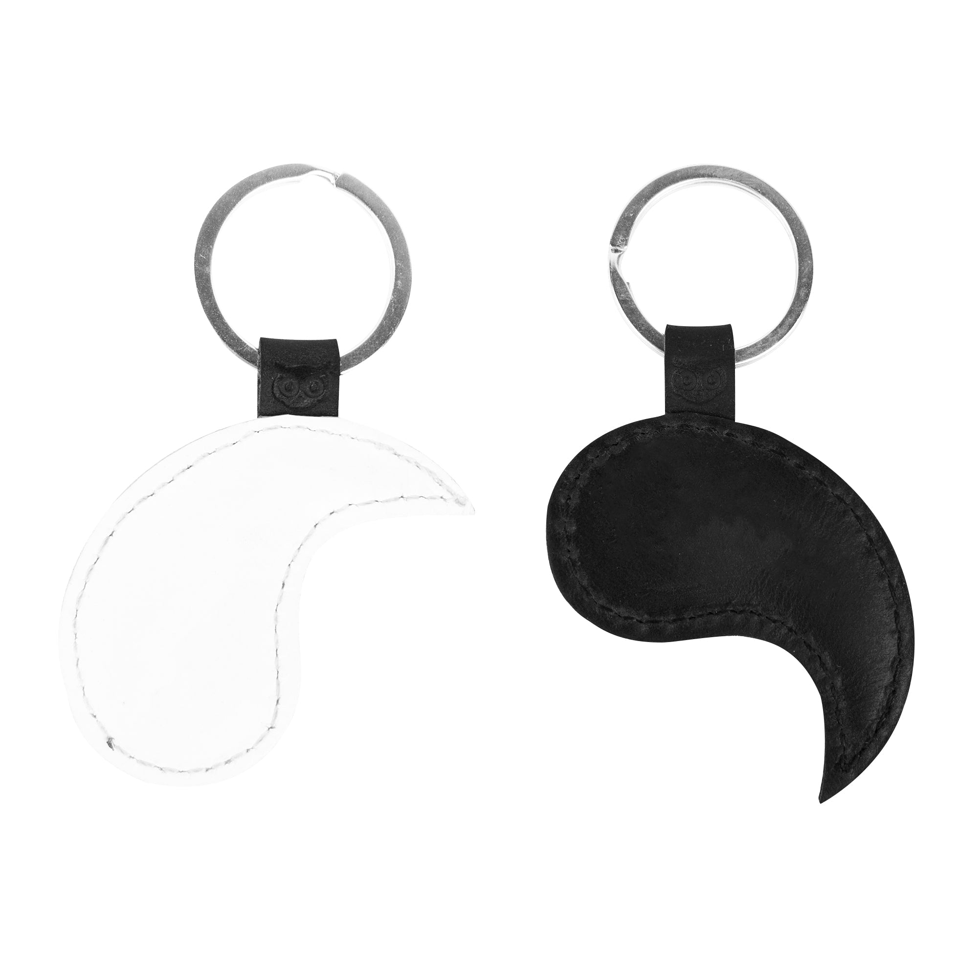 Charming Yin Yang Keychains (2 pieces) offered by Hide & Drink, featuring two unique key rings that represent unity and complementarity. Constructed from high-quality full grain leather, these keychains are not only accessories but also a nod to Chinese culture and friendship. Crafted with care using small batch production techniques, they are hand cut, hand sewn, and fire branded, symbolizing artisan craftsmanship from La Antigua Guatemala & Oaxaca Mexico.