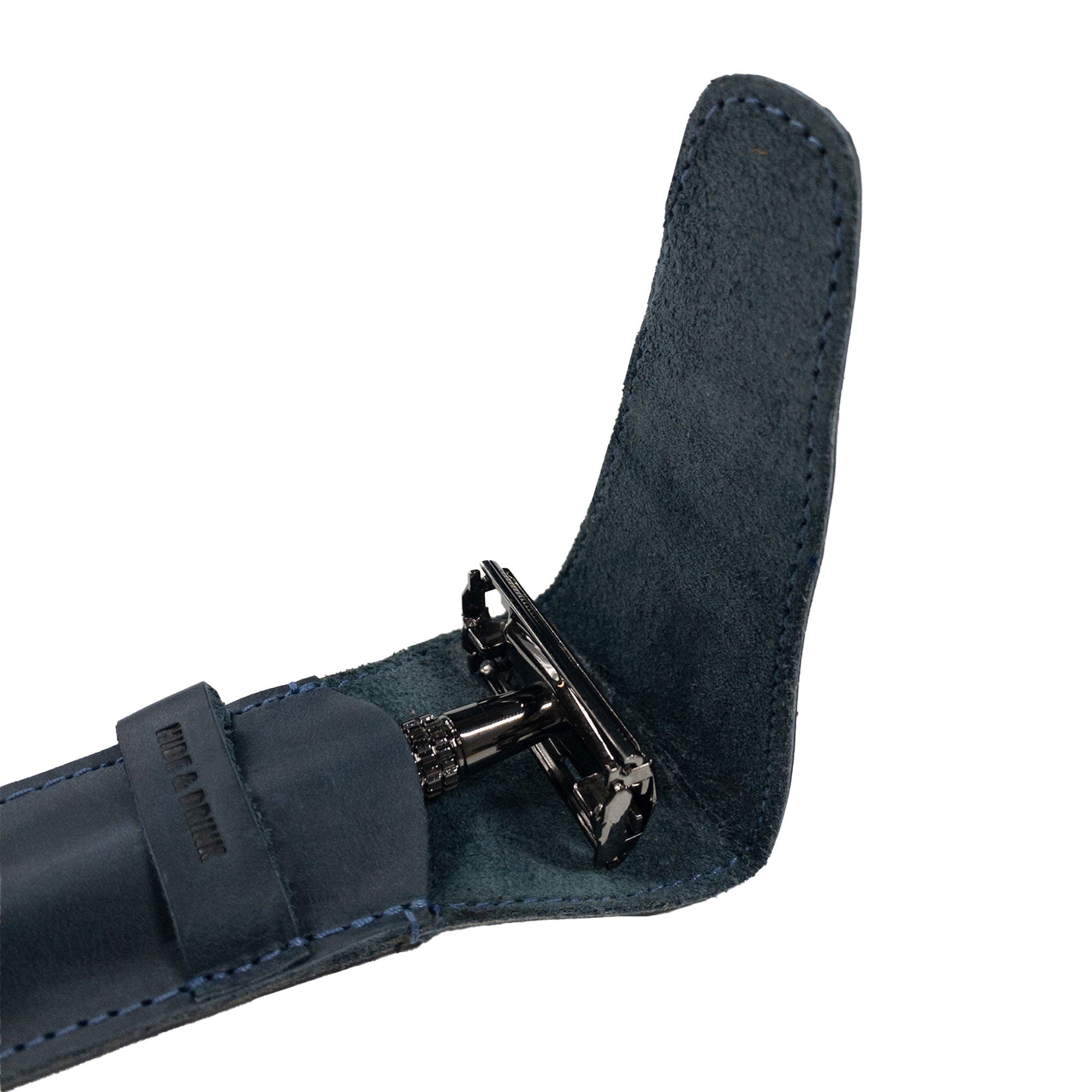 Close-up view of the Hide & Drink Safety Razor Case with a razor inside, emphasizing the artisan quality and suede interior for shaving accessories.