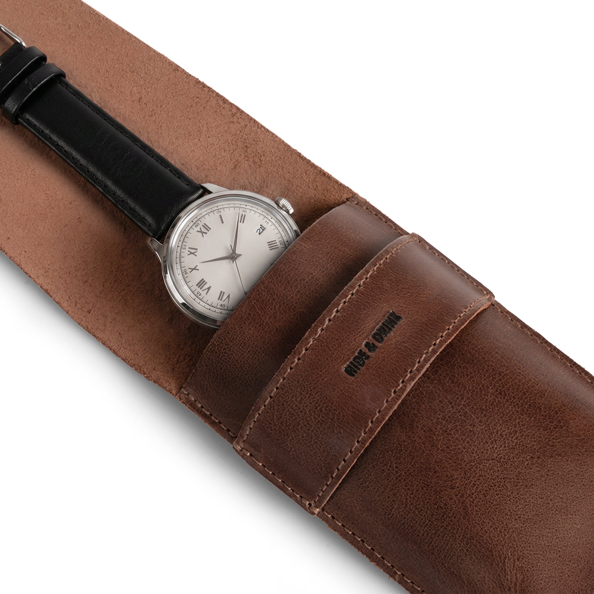 Chic Single Watch Pouch by Hide & Drink, a vintage sleeve designed for secure watch storage. This stylish accessory, made of full grain leather, is a perfect portable storage watch case for men. With its artisan craftsmanship highlighted by hand cut and hand sewn artistry, it serves as a compact carrying holder and vintage travel accessory, handmade in La Antigua Guatemala & Oaxaca, Mexico.