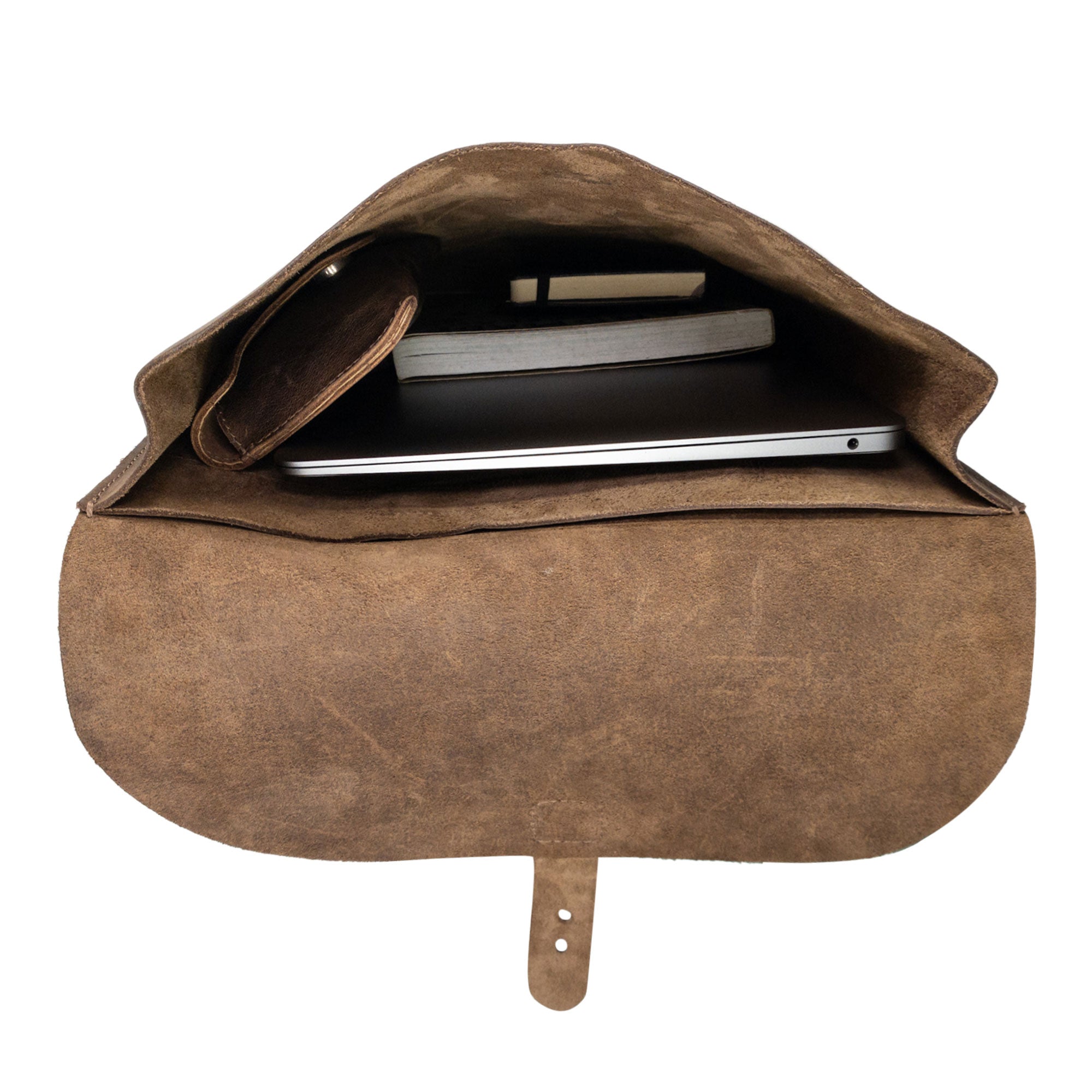 Interior view of Hide & Drink's Rounded Laptop Backpack with Adjustable Straps. The spacious compartment highlights this full grain leather design as an excellent portable case and travel accessory. Hand cut and hand sewn in La Antigua Guatemala & Oaxaca Mexico, perfect for tech enthusiasts.