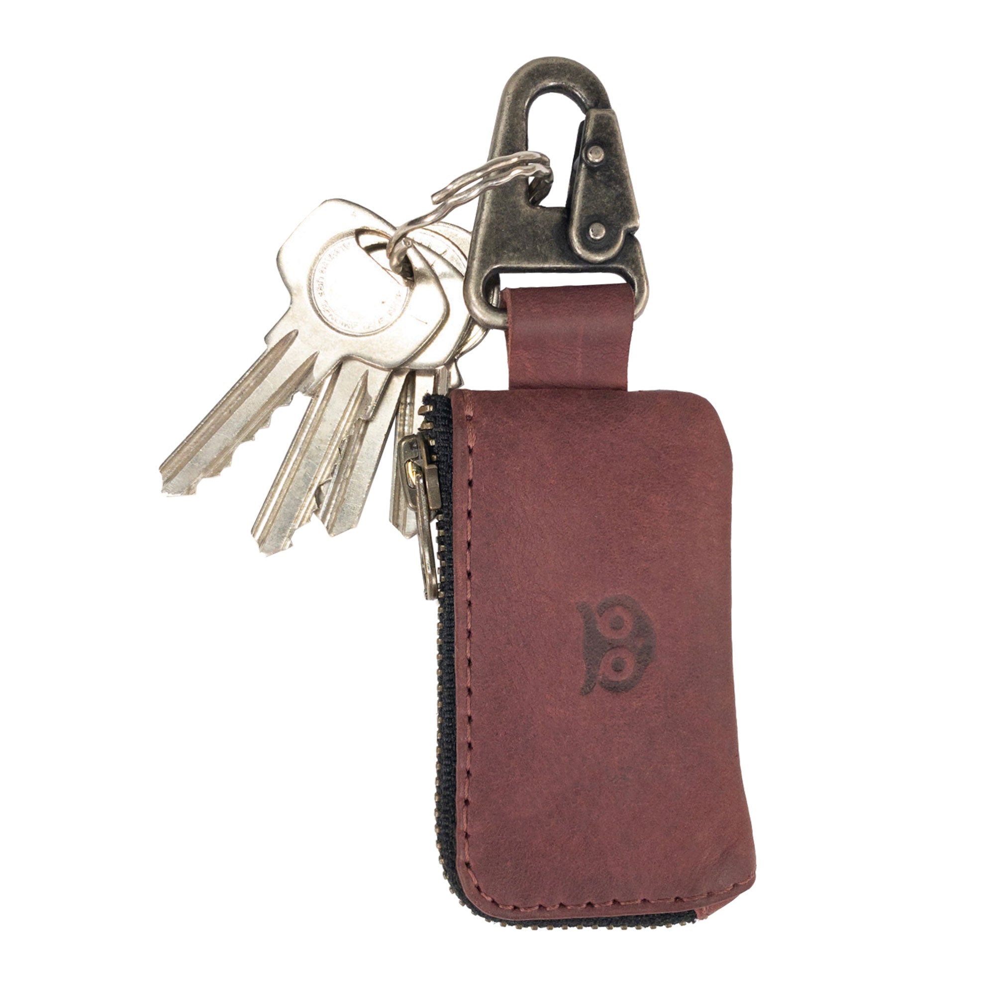Side view of the Car Key Holder by Hide & Drink, displaying its versatility to hold keys and cash while being a stylish solution for organizing Headphone and charging Cables, Memory Cards, and Flash Drives. Made from durable Full Grain Leather and featuring a Nickel Metal Clasp, reflecting the Artisan talents from La Antigua Guatemala & Oaxaca Mexico.
