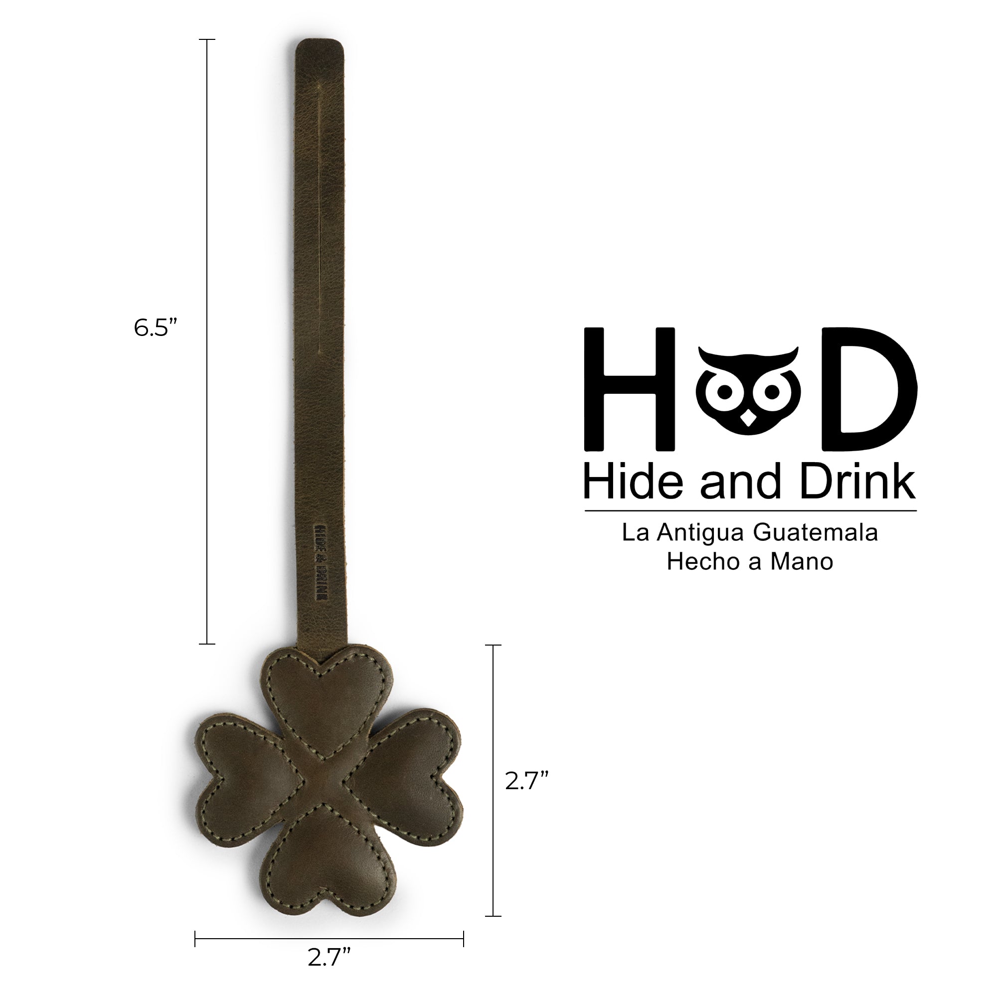 Dimensions of the Hide & Drink Clover Bag Charm displayed alongside the brand logo. This handmade accessory, crafted in full grain leather, serves as a stylish purse charm for handbags and backpacks. Artisan-made in La Antigua Guatemala & Oaxaca Mexico, highlighting its fire branded and hand sewn details.