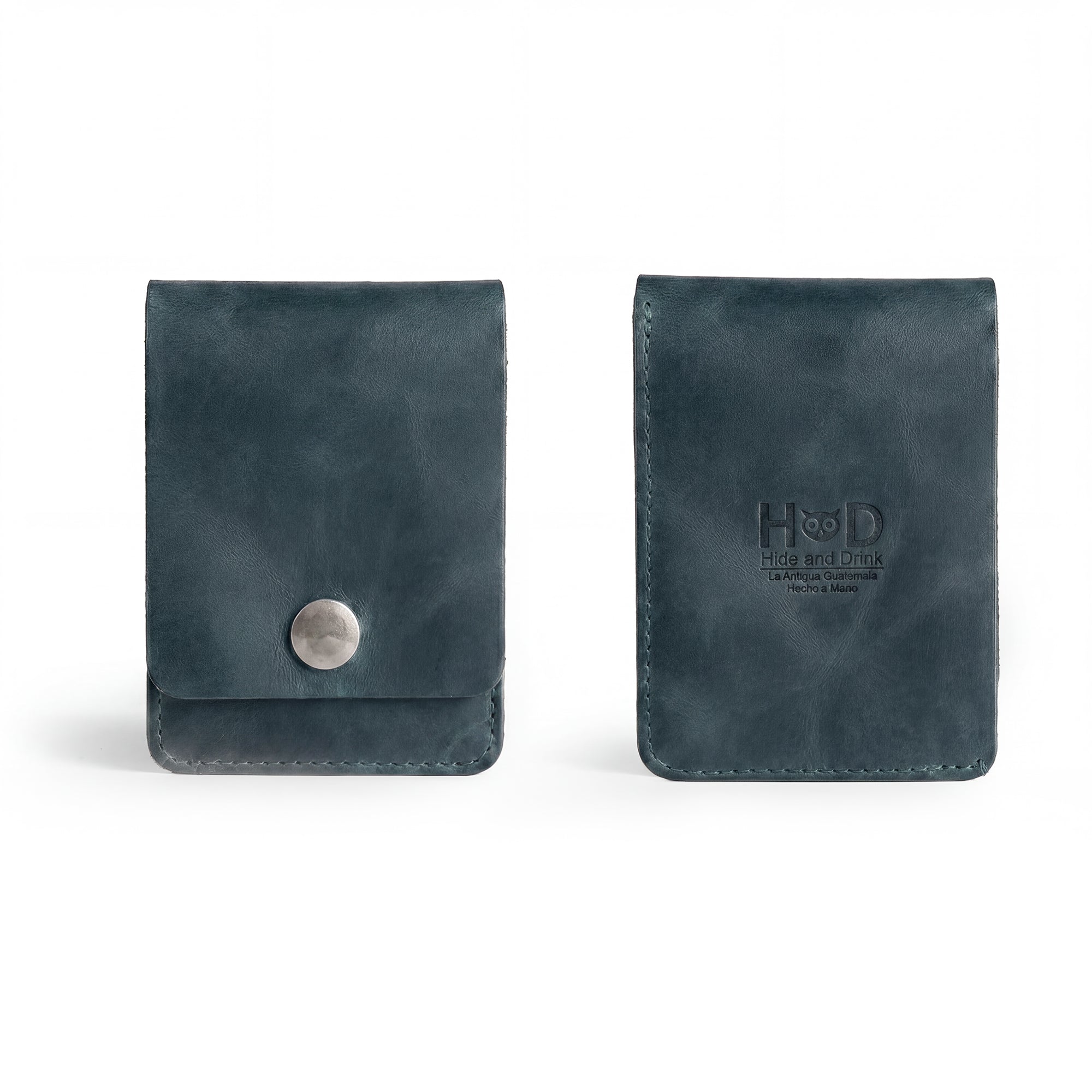 Interior view of the blue Vertical Wallet by Hide & Drink showcasing compartments for cards and notes. This Vertical Front Pocket Wallet with Card Slot provides a stylish solution for compact storage, made from durable full grain leather through small batch production techniques, hand cut and hand sewn with fire branding. Handmade in La Antigua Guatemala & Oaxaca Mexico.