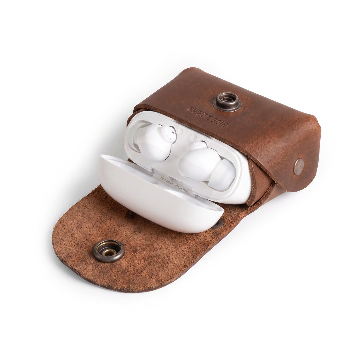 Tiny Handbag Keychain featuring a rustic design with key ring holder, crafted from full grain leather by Hide & Drink. This artisan-made Tiny Handbag with Key Ring Holder, Full Grain Leather, showcases small batch production, hand cut, hand sewn, and fire branded techniques, handmade in La Antigua Guatemala & Oaxaca Mexico.