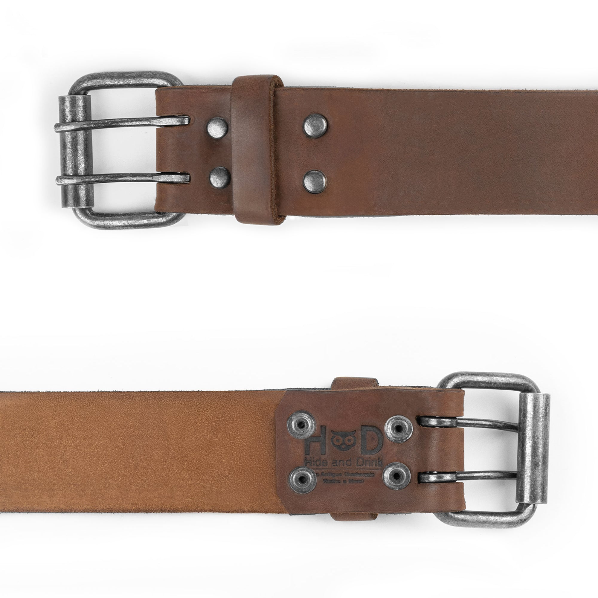 The back view of the Reinforced Double Prong Buckle Belt by Hide & Drink, showcasing the rustic double prong buckle. This durable belt is 1.5 in. wide and crafted from full grain leather, exemplifying stockyardX craftsmanship through small batch production, hand cut, hand sewn, fire branded, and artisan-made in La Antigua Guatemala & Oaxaca Mexico.