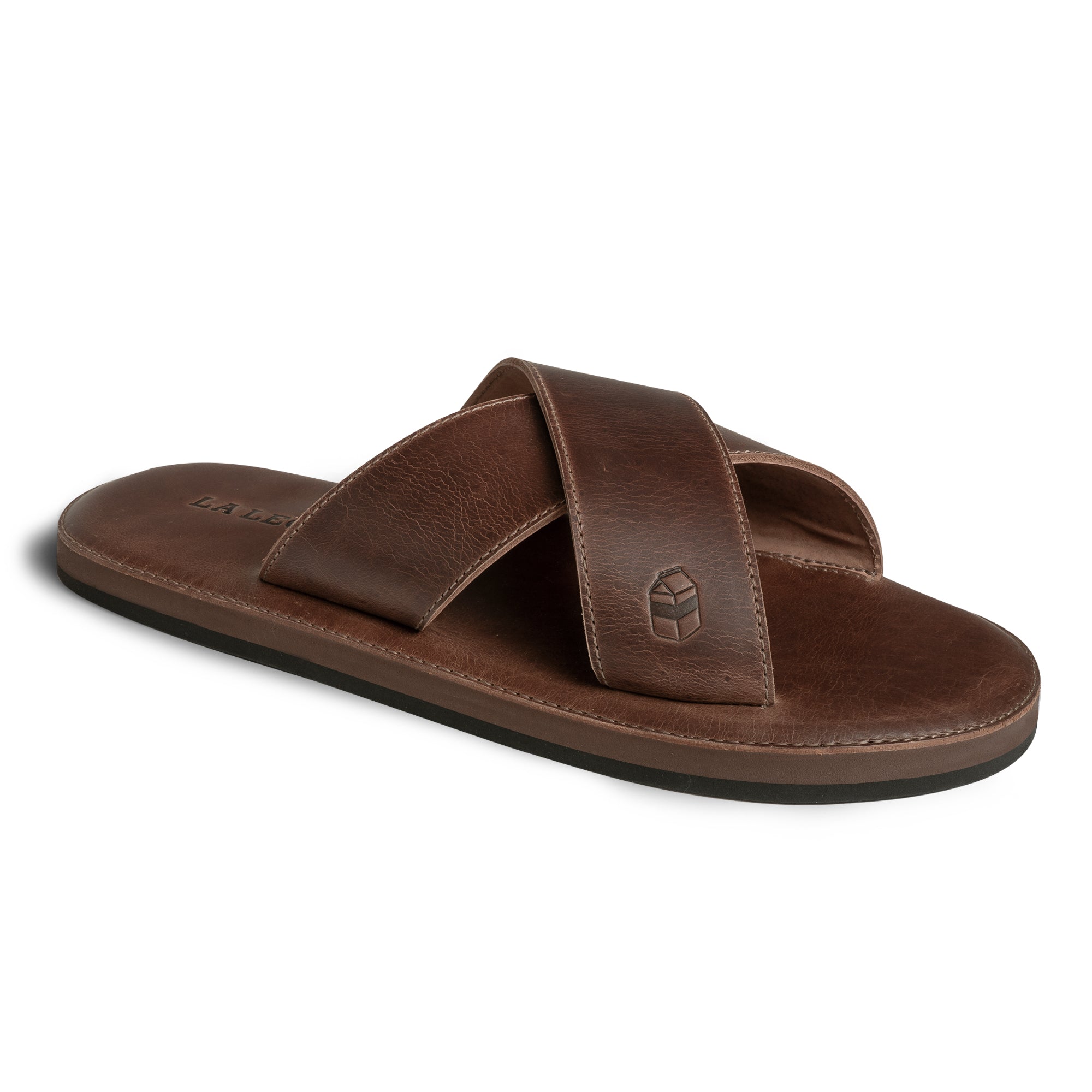 A 3D angle of The Wanderer Arch Comfort Sandals highlighting the elegant curvature and rich color of the leather. Created by La Leche, these sandals provide exceptional comfort with Memory Foam insoles and are suitable for both indoor lounging and outdoor activities. Each pair is artisan-made, showcasing the craftsmanship involved in small batch production.