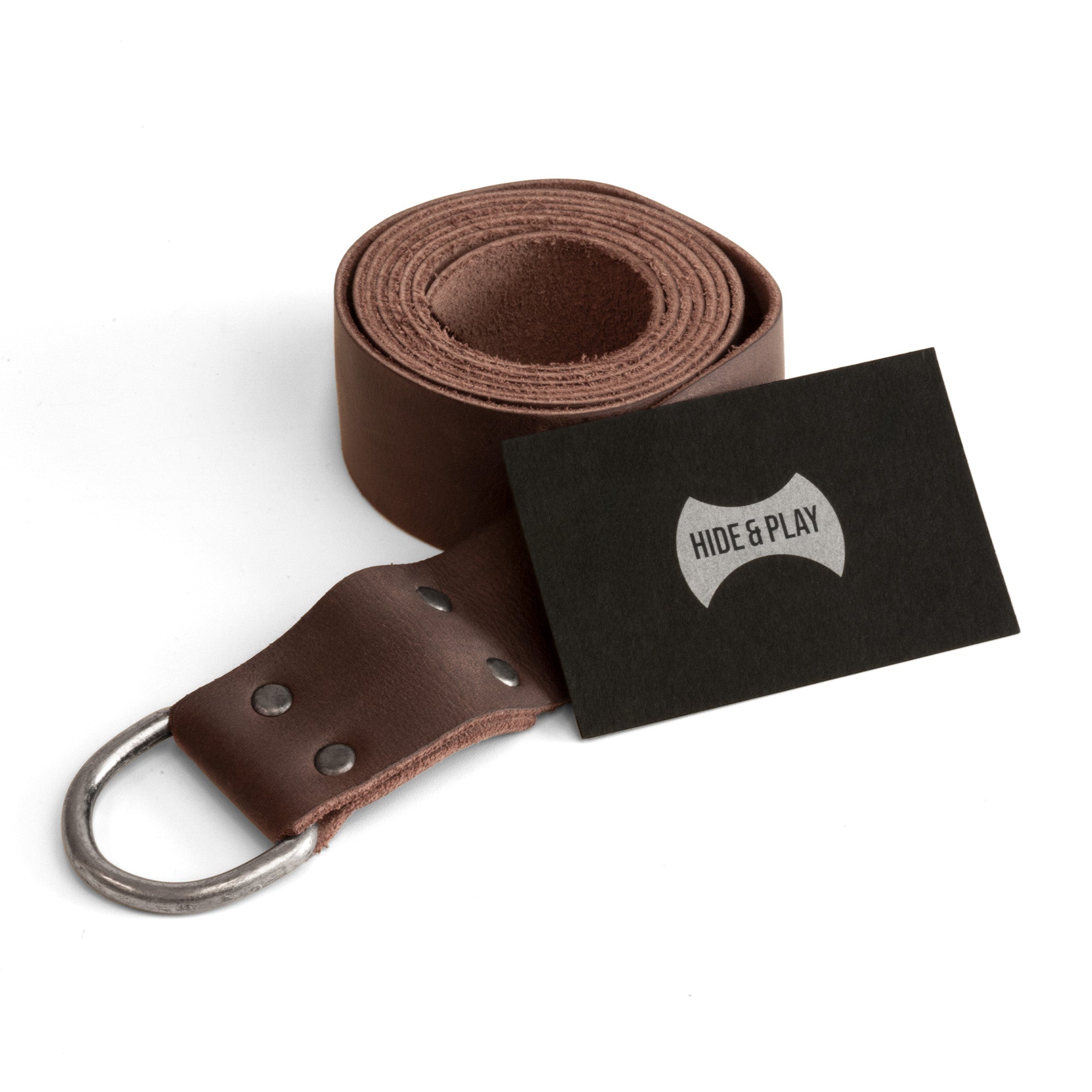 Medieval Knight Belt by Hide & Play, paired with a business card, emphasizing the quality and branding. This Full Grain Leather Medieval Knight Belt for Men makes a perfect Renaissance Viking Belt for Costume or Cosplay, handcrafted in La Antigua, Guatemala, showcasing small batch production and artisanal methods.
