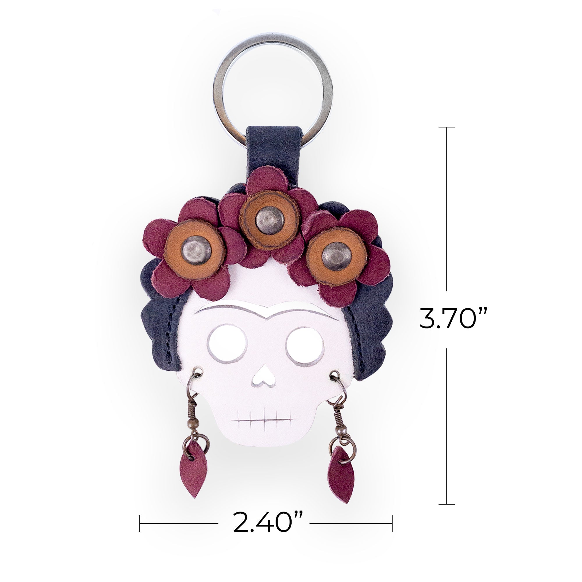 Dimensions of the Lady Skull Leather Keychain by Hide & Drink, illustrating its compact size and vibrant design. This handy keyring is a great key organizer inspired by Day Of The Dead, made from durable Full Grain Leather and reflecting rich Mexican culture, handcrafted in La Antigua Guatemala and Oaxaca Mexico.