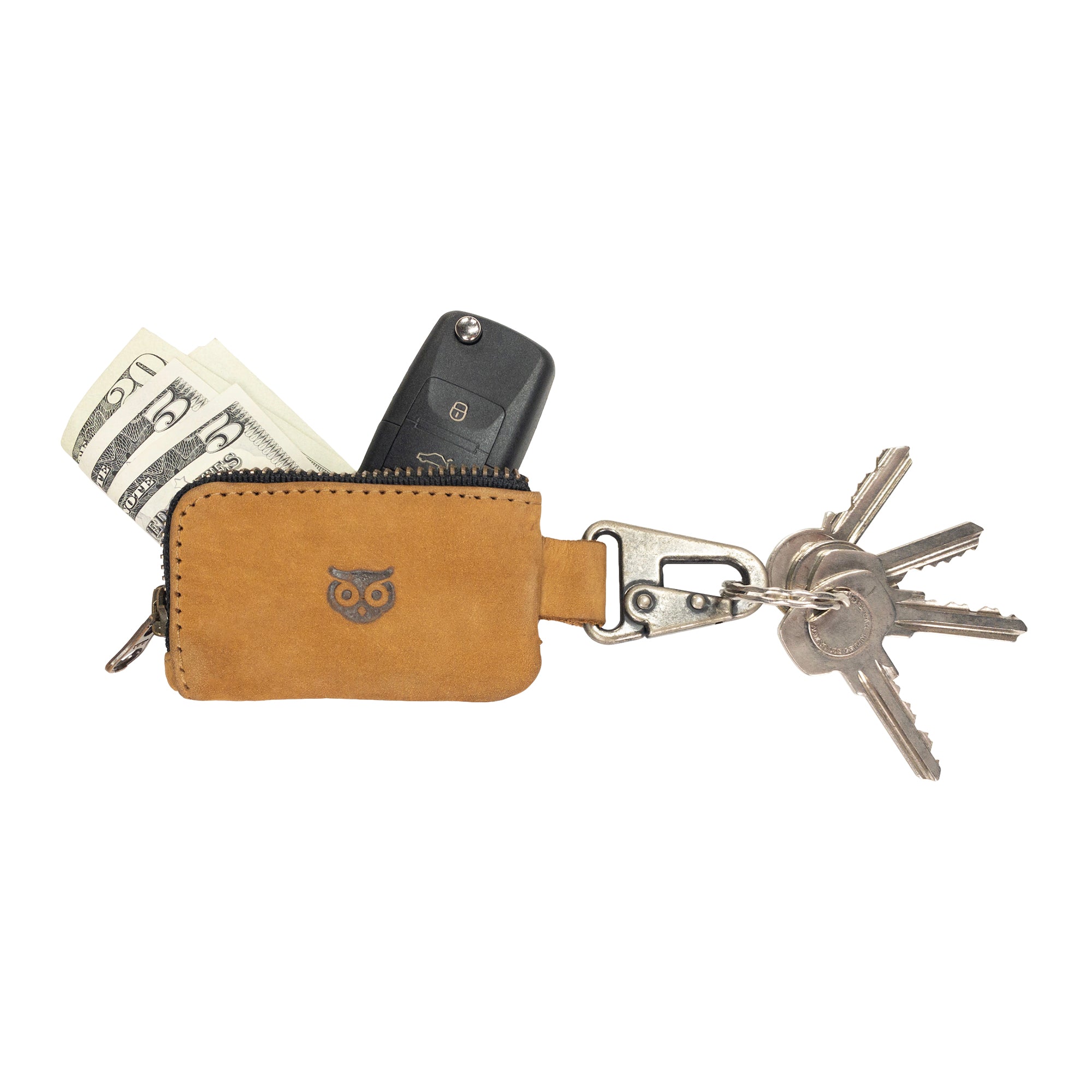 Close-up of the Car Key Holder by Hide & Drink with keys attached, showcasing its full grain leather craftsmanship. Ideal for holding cash, headphone cables, and flash drives, artisan made in La Antigua Guatemala & Oaxaca Mexico.