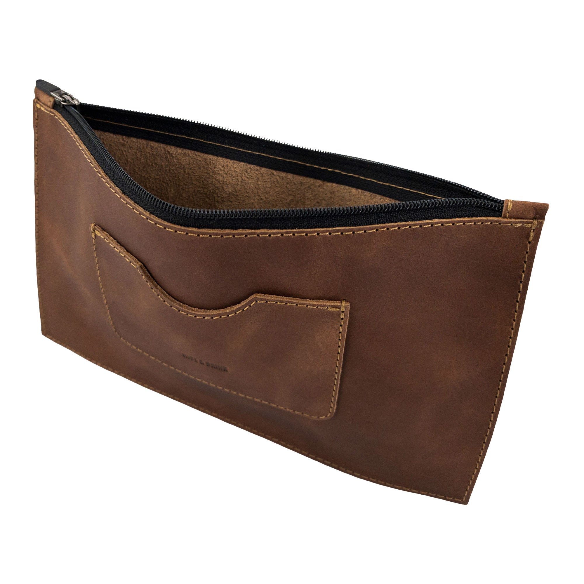 A closer look at the zipper of a brown rectangular zippered handbag by Hide & Drink, showcasing its interior and card slot. This stylish female purse is made from durable full grain leather, representing artisan craftsmanship and small batch production, handmade in La Antigua Guatemala & Oaxaca Mexico.
